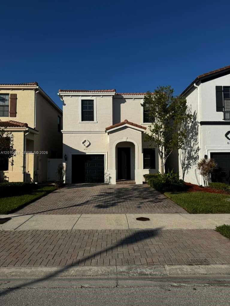 Welcome to this beautifully maintained 3BR/2.5BA home offering 1,808 sqft of bright and functional living space in the highly desirable, guard-gated community of Champion Lakes. Thoughtfully designed for both comfortable daily living and effortless entertaining, this home features an open-concept layout, a well-appointed kitchen with granite countertops and stainless steel appliances, and a warm, inviting atmosphere throughout. All three bedrooms are located upstairs, providing privacy and tranquility. The fenced backyard offers the perfect setting for outdoor gatherings or the opportunity to add your own pool. Residents enjoy resort-style amenities including a community pool, tennis courts, playgrounds, and scenic walking trails — all within a 24/7 secured community. Conveniently located with easy access to Miami, Aventura, and Fort Lauderdale. This one is a must-see!
