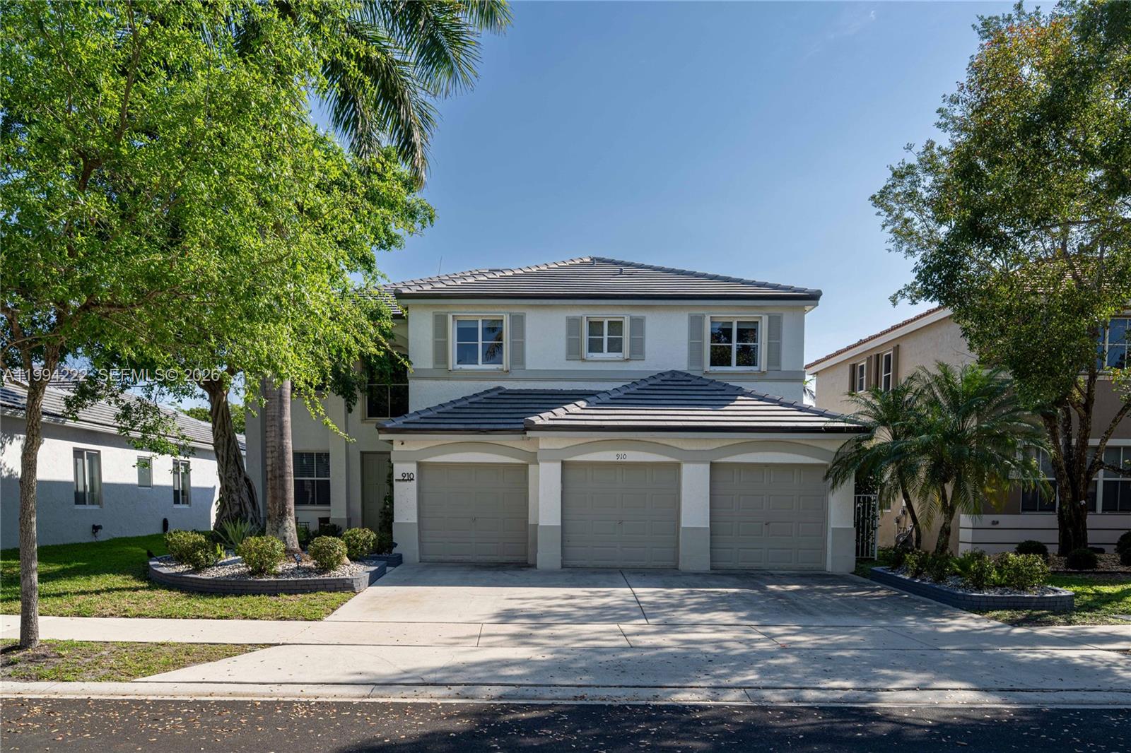 Absolutely stunning lakefront home, offering the perfect blend of luxury, space, and privacy. This fully remodeled residence features 5 spacious bedrooms, 4 full bathrooms, and a 3 car garage, situated on a private lot with serene lake views. The thoughtful floor plan includes one guest bedroom located on the first floor and a full bathroom, perfect for friends, extended family or an office. Upstairs, a breathtaking primary suite with a stunning custom walk-in closet, 3 additional bedrooms, one en-suite and two sharing a well-designed Jack-and-Jill bathroom. The home has porcelain floors downstairs and wood flooring upstairs, abundant natural light, and a completely remodeled interior with modern finishes. The remodeled kitchen featuring high-gloss cabinetry, quartz countertops, and stainless steel appliances. Major upgrades include a new roof (2026) and impact windows upstairs.
The open-concept living spaces flow seamlessly into the outdoor oasis, where a heated pool overlooks the lake, complete with a BBQ area and exceptional privacy, with no neighbors across the water. Additional exterior enhancements include a resurfaced pool, marble pool deck, pool lighting, sprinkler system, and fully redone front and back landscaping—all completed in 2021.
With premium upgrades, generous living spaces, and a truly private backyard setting, this home is move-in ready and one of the finest lakefront opportunities in Weston.