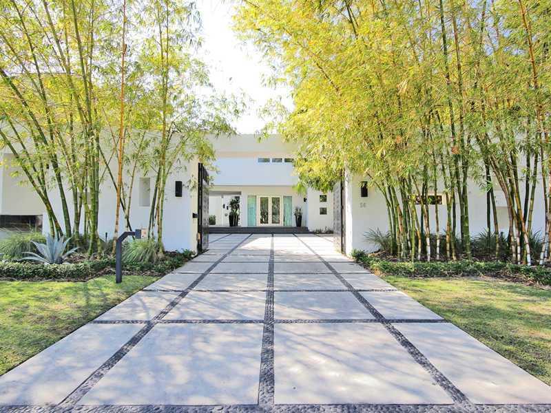 New contemporary home located in guard gated Bal Harbour. This stunning "smart" home is completely furnished & appointed with the finest amenities. Features gourmet kitchen with double appliances, 3 car garage, rooftop observation deck, infinity pool & Ja cuzzi, triple staircases, high ceilings, boat lift & dock, plus outdoor terraces off of every room with sweeping water views. Cutting edge design & finishes. Only 31 waterfront homes in this exclusive neighborhood.