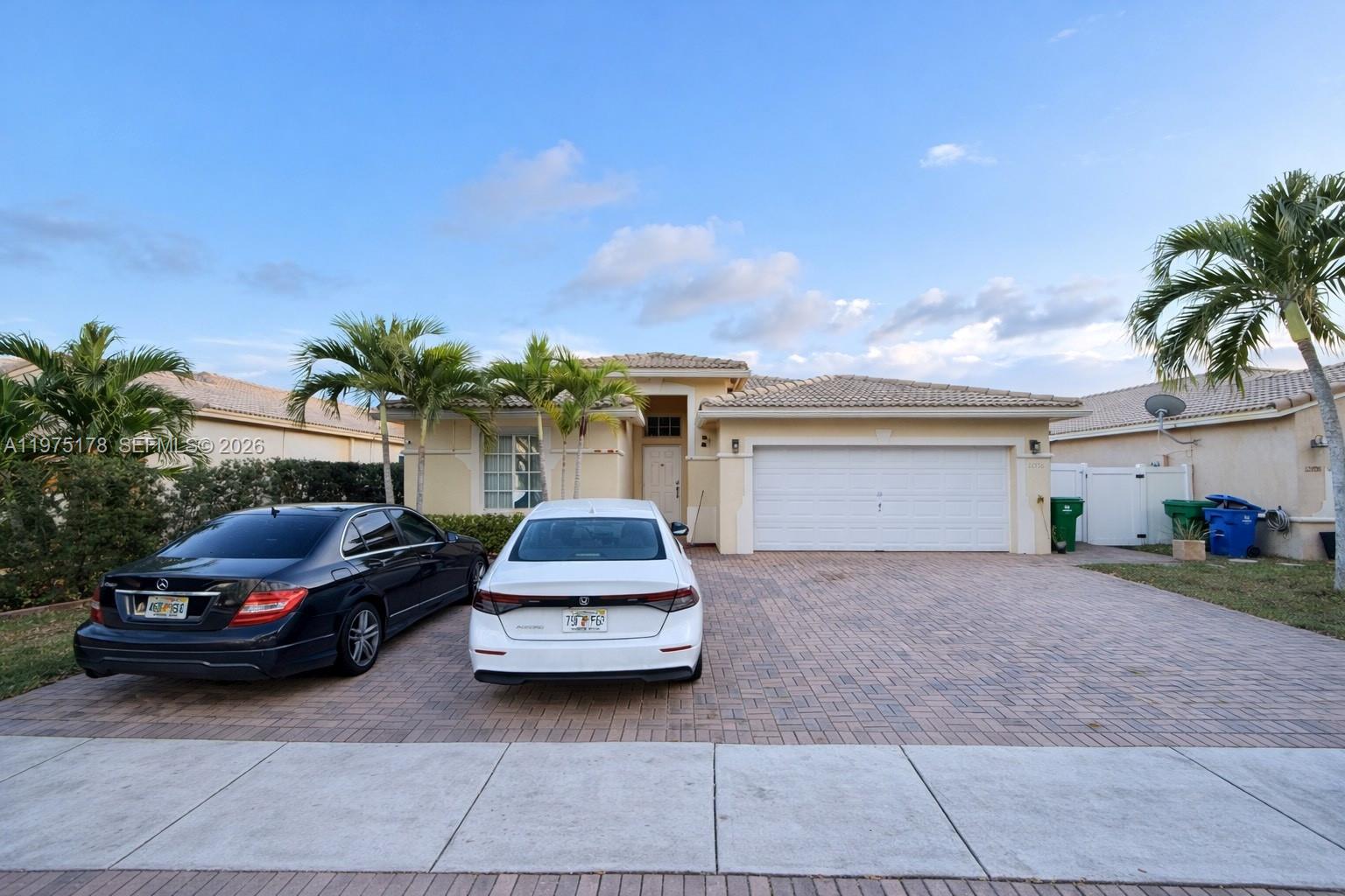 Beautiful 4-bedroom, 2.5-bath home built in 2004 offering 1,944 sq ft of living space in the desirable gated community of Silver Falls in Miramar with 24-hour surveillance. This spacious home features separate living room, dining room, and family room areas, providing plenty of space for living. The oversized primary suite has a large bedroom and a beautiful, spacious bathroom. Additional highlights include a fully equipped  in-law quarters, tile roof, fully fenced yard, private pool with built-in BBQ area, and solar panels installed in 2020 providing approximately 40% savings on monthly electric bills. A perfect blend of space, efficiency, and functionality.