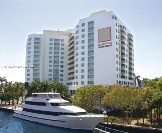 Amazing Location!!! Just minutes walking from Galleria Mall, Beach, Restaurants, Shops and much more. This is a fully furnished 1/1 condo with a big balcony (unit has a city view). It's a Condo-Hotel Building and comes with great amenities: pool, restaurant, bar, gym, business center, laundry facility, valet parking, and even has a dedicated water taxi stop. Unit is turn key ready and can be rented daily with the Hilton Rental Program, on AirBnB or by the owner directly. Maintenance fee includes everything: insurance, water, electric, TV, internet, exterior maintenance, landscaping, etc... Great for investors, part-time or even full time residence.