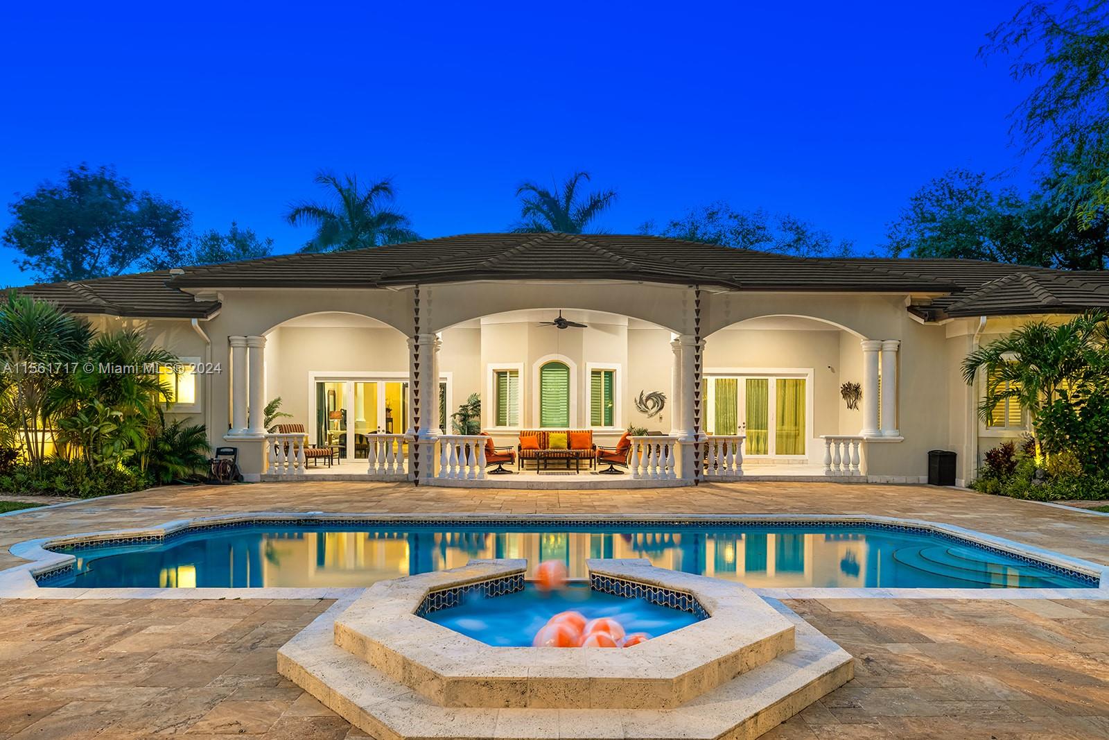 Exceptional estate nestled on a rarely available corner acre lot in the heart of North Pinecrest. Enter through new electric gates to find a grand driveway of Chicago brick w/parking for up to 12 cars & a 2-car A/C garage. This private move-in ready residence was completely renovated w/a brand new roof, impact windows/doors, new baths, laundry room w/sink, & open new gourmet kitchen w /cabinets, counters & high end appliances. Enjoy 5 spacious bedrooms, a terrific floor-plan, high 12ft ceilings, elegant sun-filled living spaces, walk-in pantry, & wine cellar (fits 750+ bottles). Relax & entertain in style in the fenced resort-style backyard oasis! Boasting an expansive covered lanai, heated saltwater lap pool w/huge deck, spa, & lush landscaping. NOT IN FLOOD ZONE! Whole house generator.