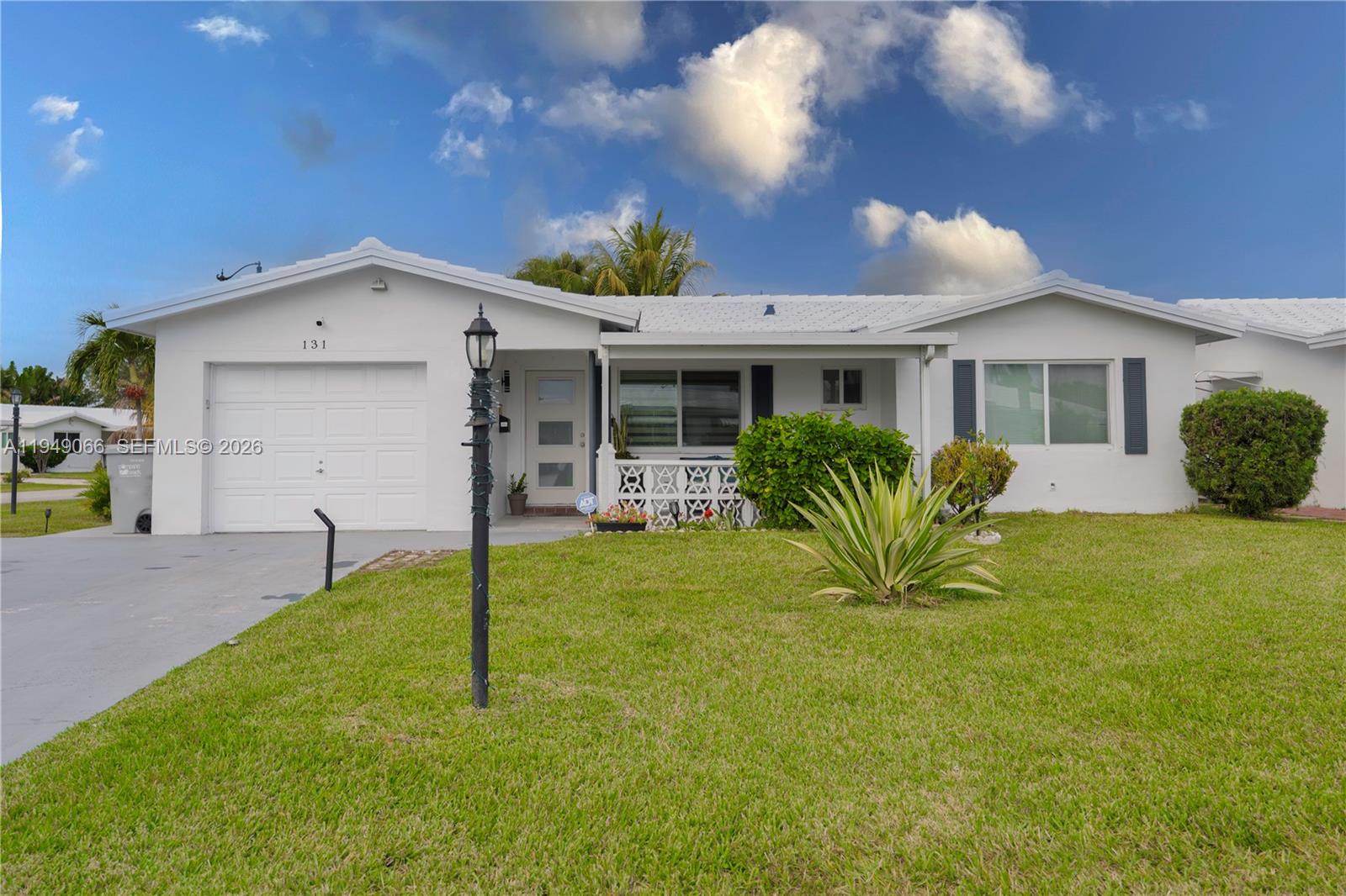 Updated 2BR/2BA home with enclosed patio and a extra  room and one-car garage, situated on a large corner lot in the desirable Leisureville 55+ community. Features include a granite kitchen, new washer & dryer, new A/C, ceramic tile throughout, impact windows, surveillance system, and a 3-year-old roof. Covered front patio and double driveway for up to 4 cars. Community amenities include 2 pools, clubhouse, and a 9-hole golf course. SELLER IS MOTIVATED CALL ME FOR DETAILS.