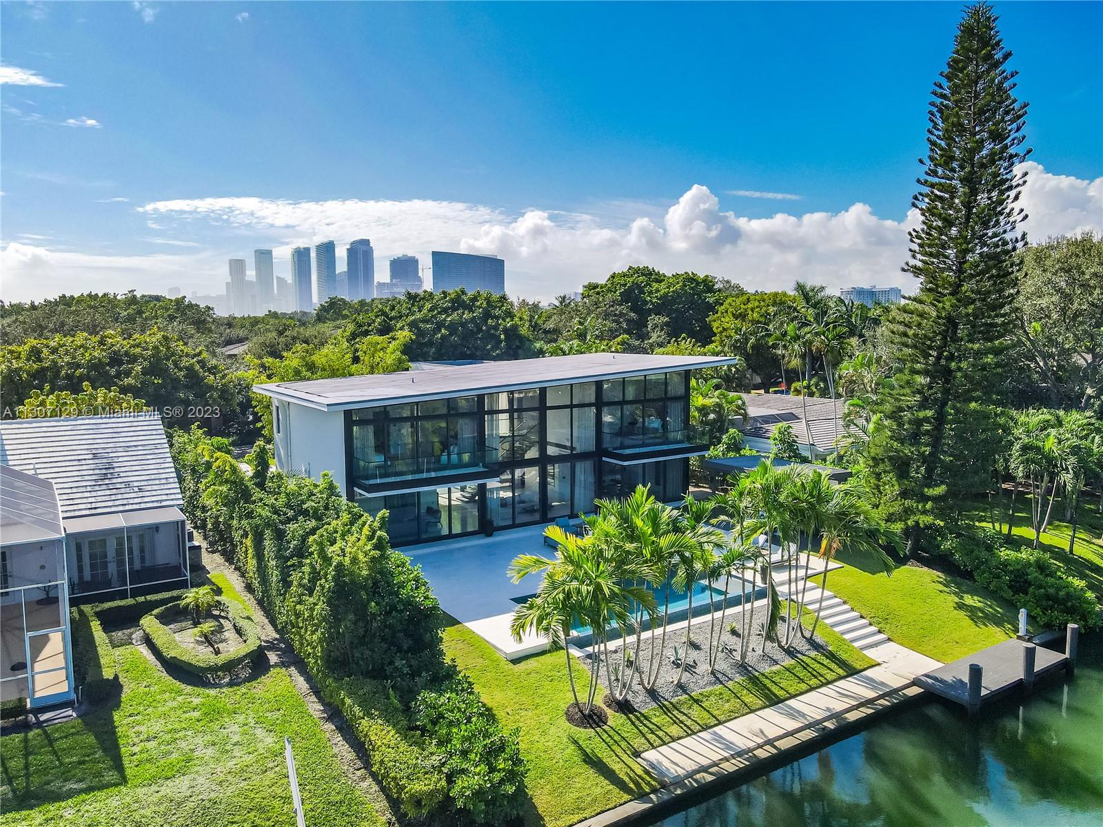 Nestled within one of Miami’s most sought-after private guard gated communities, Bay Pointe Estates offers unparalleled privacy and safety, making it a top choice for families. 721 Buttonwood Ln boasts nearly 5,000sqft of living space on a 14,000sqft lot including 5 beds and 5.5 bath. This unique modern home features 92ft on the water with no fix bridges, making it a boaters paradise with access to the open bay. With over 20-foot ceilings and large floor to ceiling windows, in the living spaces and primary bedroom the natural light that penetrates the living space is vibrant and exceptional. This property's ideal location provides easy access to Miami Beach, Wynwood, Brickell, and the Miami International Airport, as well as proximity to some of the city's finest schools.