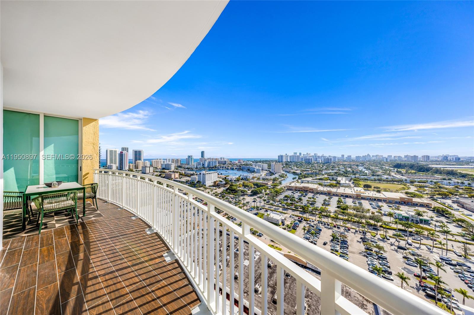 Indulge in breathtaking views from every room in this modern 2 Bed & 2 Bath gem in Hallandale Beach. The heart of the home boasts a sleek new Calacatta Viola marble kitchen island paired with stainless steel appliances. Relax in the sun-drenched living area with a custom installed automated projector screen, flow seamlessly into the thoughtfully defined dining space, and retreat to spacious bedrooms - complete with a primary suite featuring a walk-in closet and upgraded bath. Each room thoughtfully equipped with automated roll down blinds/shades.

The building offers residents with resort-style amenities, including a heated swimming pool, jacuzzi, tennis courts with stunning views, business center, fitness center, sauna, steam room, game room, 24-hour concierge, valet services, and a gated guard for added peace of mind. HOA includes internet, cable, 1 assigned parking, 1 valet parking and total appliances package.

Centrally located in Hallandale Beach with dining, shopping and fitness just steps away. Enjoy a leisurely stroll or bike ride to the beach, indulge in shopping and entertainment at nearby GulfStream park and Aventura Mall. Sleek design, breathtaking vistas, and unmatched amenities—this is coastal living at its finest. Don't miss the opportunity to call this your home!