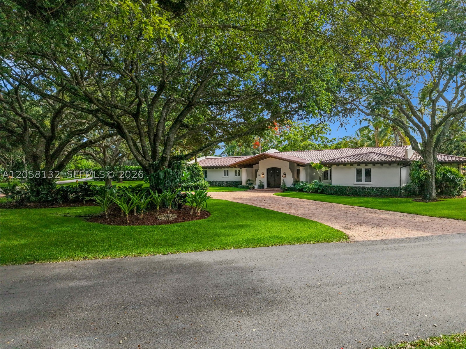 Renovated 4-bedroom, 4.5-bath home with a den offering 4,474 SF of living space on a .69-acre lot in a quiet, tree-lined neighborhood. Built in 1956 and renovated in 2005, the home features travertine floors, spacious living areas, and abundant natural light. The kitchen includes Calacatta Gold marble countertops, Sub-Zero appliances, a Wolf range, and a large center island. The primary suite features a steam shower and soaking tub. Outdoor amenities include a pool, tiki pavilion, brick patio, and landscaped yard. Additional features include a new roof (2024) and a two-car garage.