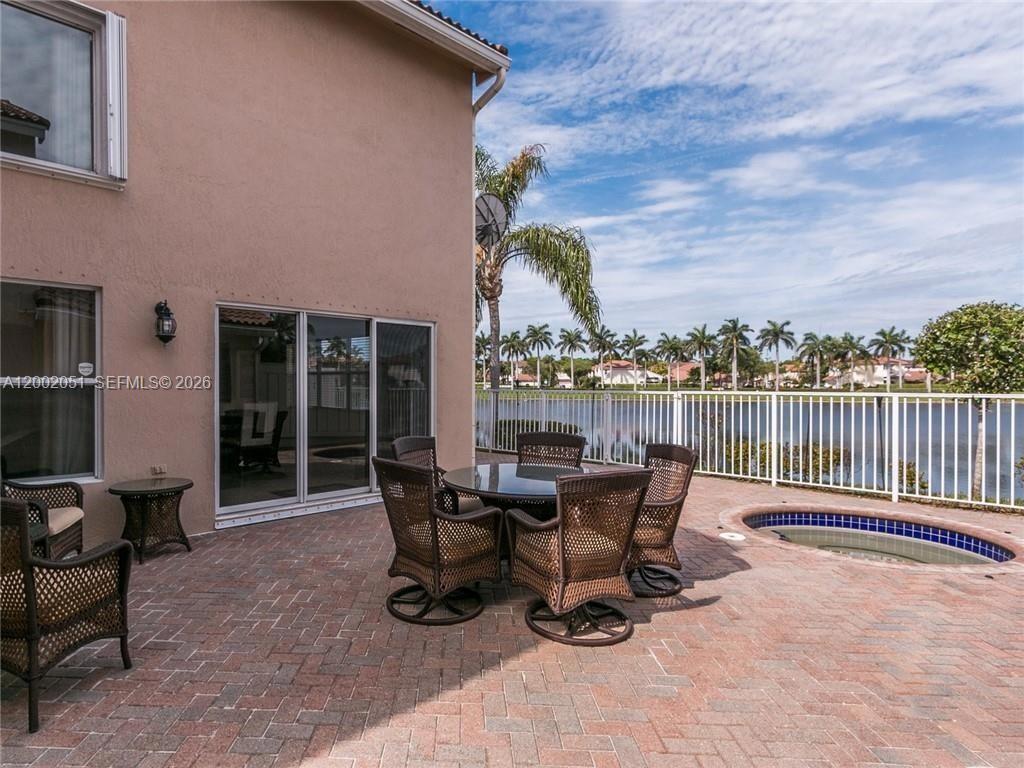 WHAT A VIEW. LAKEFRONT + 7' HEATED SPA, VERY WELL MAINTAINED AND UPGRADED. CHERRY WOOD CABINETS AND BUILT INS, GRANITE, STAINLESS STEEL APPLIANCES, RECESSED LIGHTING, VAULTED CEILING, CUSTOM VANITIES, CHERRY WOOD FLOORS UPSTAIRS WITH TOTALLY REDESIGNED MASTER BATHROOM INCLUDES A 3 X 6 STALL SHOWER AND A MAKE-UP STATION,  LARGE YARD HAS PAVERS AND ROOM FOR POOL. 2 CAR GARAGE.