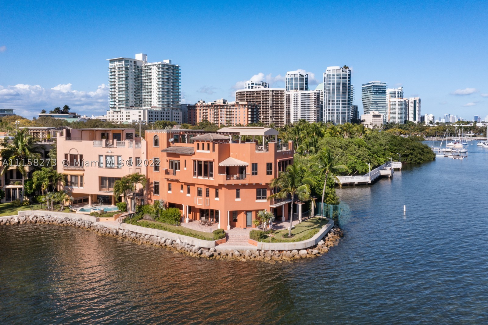 Once in a lifetime opportunity to own the Premium location at The Cloisters. Right on the point with 100sf of seawall. Amazing panoramic ocean & city views. This stunning, spacious, 4-story 4/4.5 townhouse/villa with elevator features 5,739sf. The 2nd floor host 3 bedrooms with en-suite baths, including a massive Main BR with spectacular views. The 3rd floor has a kitchen, huge family room with wet bar, formal dining area, 2 story office and office/guest BR. This unit has an exquisite outdoor rooftop area that includes gas fireplace, summer kitchen to be able to entertain & relax. Installing full house generator and new deck. Amenities include clay tennis court, pool & clubhouse & 24 hour security. Walk out and your in the heart of Coconut Grove!