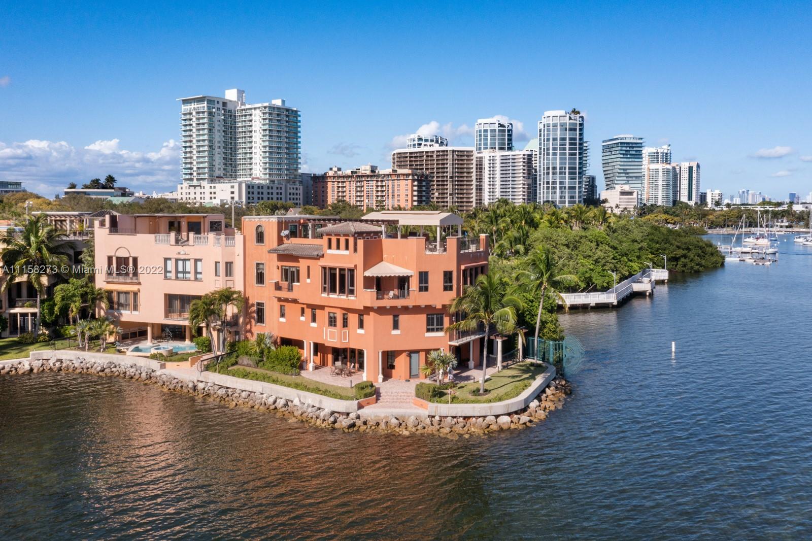 Once in a lifetime opportunity to own the Premium location at The Cloisters. Right on the point with 100sf of seawall. Amazing panoramic ocean & city views. This stunning, spacious, 4-story 4/4.5 townhouse/villa with elevator features 5,739sf. The 2nd floor host 3 bedrooms with en-suite baths, including a massive Main BR with spectacular views. The 3rd floor has a kitchen, huge family room with wet bar, formal dining area, 2 story office and office/guest BR. This unit has an exquisite outdoor rooftop area that includes gas fireplace, summer kitchen to be able to entertain & relax. Installing full house generator and new deck. Amenities include clay tennis court, pool & clubhouse & 24 hour security. Walk out and your in the heart of Coconut Grove!