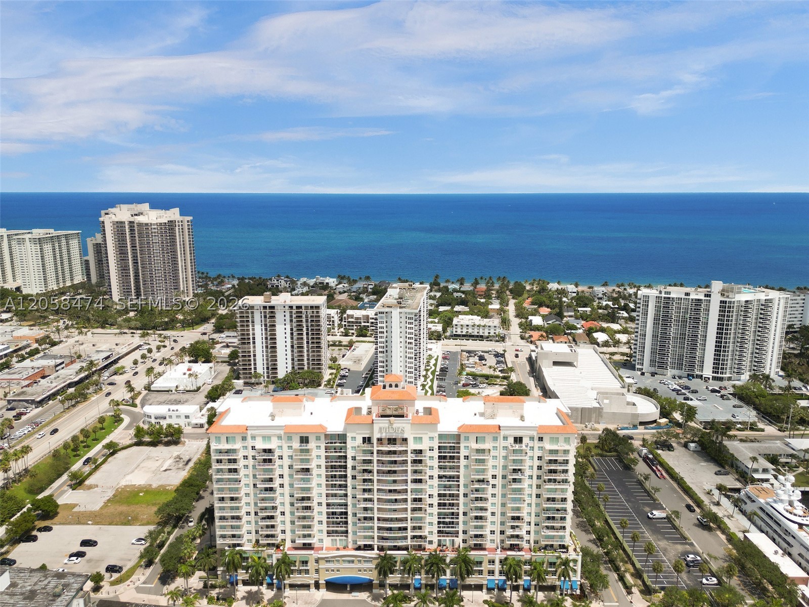 Perched on the 16th floor of The Tides at Bridgeside Square, this rarely available 2BR/2BA penthouse-level residence offers breathtaking, panoramic direct ocean views. East-facing living room and bedrooms with a tiled balcony capture stunning sunrises over the water, while a mirrored accent wall amplifies natural light throughout. Beautiful vinyl wood look floors thru-out. The open kitchen impresses with a large breakfast bar, quartz waterfall counters, glass tile backsplash, deep undermount sink, pulldown faucet, recessed lighting, and stainless-steel appliances with a cooktop range and microwave. The serene, spacious primary suite features double closets w/ built-in shelving and an ensuite bath with tub/shower combo; secondary bath offers a large vanity mirror, modern lighting and coastal accents. Custom blackout drapes in living room & bedrooms, in-unit laundry/utility room w/ front-load washer & dryer. Resort-style amenities include a hot tub, fitness center, tennis court, clubhouse, business center, BBQ/picnic area and pool, with cable and internet all included in the Association fee. Unbeatable, walkable location just steps to Fort Lauderdale beach, waterfront dining, boutique shopping, cafes, nightlife and the water taxi, with a newly opened Publix right behind the building. Easy access to Las Olas & downtown Fort Lauderdale. Don't miss this rare opportunity to own a slice of coastal, high-rise, luxury! One of the best places to live.