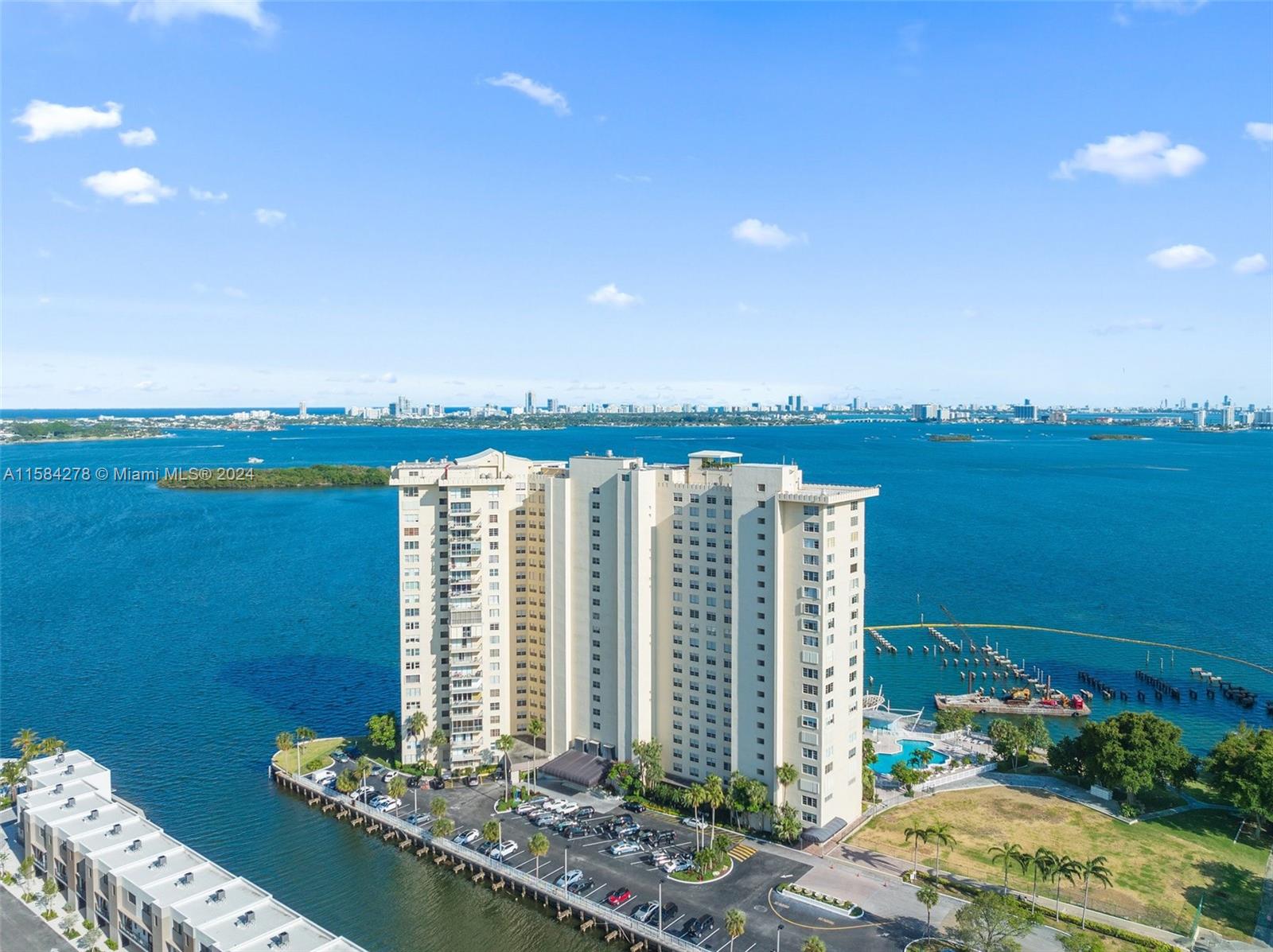 Step into urban sophistication in North Miami with this exquisite 2-bed, 2-bath corner unit condo. Enjoy a seamless fusion of style and comfort with a closed-off balcony expanding the living space. Upgrades include hurricane shutters, new circuitry, new AC unit, and removal of popcorn ceiling. Embrace vibrant living with easy access to dining, shopping, and entertainment options.

This residence boasts an inviting ambiance, perfect for both relaxation and entertaining. The kitchen is a culinary haven with sleek countertops, modern appliances, and ample storage space. Whether hosting intimate gatherings or preparing gourmet meals, this kitchen is sure to impress. With its prime location and thoughtful upgrades, this condo offers modern convenience and style in the heart of North Miami.