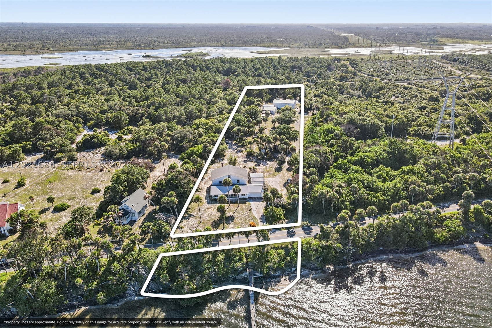 Direct, unobstructed views of the Indian River Lagoon and the Atlantic Ocean define this private, gated 3.8-acre coastal estate. Featuring zero immediate neighbors to the east, north, or west, this unique compound maximizes isolation. Built, expanded, and meticulously maintained by a commercial contractor who lived on-site, the property pairs deep-water access with serious storage capabilities.

The main residence spans well over 4,000 sq ft. The core layout features 4 bedrooms and 5 bathrooms situated entirely downstairs. Upstairs, the home opens into a massive, flexible loft space with an additional full bathroom—an ideal footprint ready for a seamless expansion, master suite conversion, or extra bedrooms. Waterfront utility is a major asset here, featuring a private dock with immediate deep-water access to the Intracoastal Waterway for boating and fishing right from your backyard.

Beyond the main home, a separate detached building provides excellent flexibility. It is fully functional as an independent guest house, private mother-in-law suite, or a dedicated entertainment house. For vehicles and equipment, the property features a major operational _bonus_: a functional warehouse equipped with high ceilings and heavy roll-out doors, ideal for secure boat, RV, or fleet storage, supplemented by numerous large carports.

Owner occupied but easy to show. This is truly a special, unique piece of real estate. Please don't hesitate to reach out or schedule a showing.