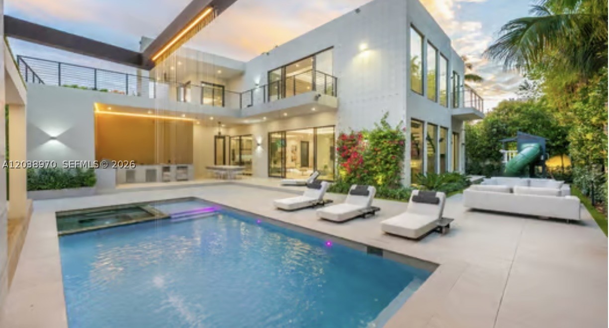 Exceptional South Coconut Grove modern estate situated on an oversized lot along one of the neighborhood's most desirable tree-lined streets. This 5BR/6.5BA residence offers approximately 5,445 SF of thoughtfully designed living space featuring soaring ceilings, elevator, Wolf & Miele kitchen, expansive terraces, designer finishes, motorized shades, and fully integrated Crestron smart-home technology. Resort-style outdoor amenities include a stunning pool and spa, luxury cabana, outdoor entertaining spaces, and lush tropical landscaping with mature trees and layered privacy plantings creating a true private sanctuary. Ideally located near top-rated schools, marinas, parks, dining, and shopping.