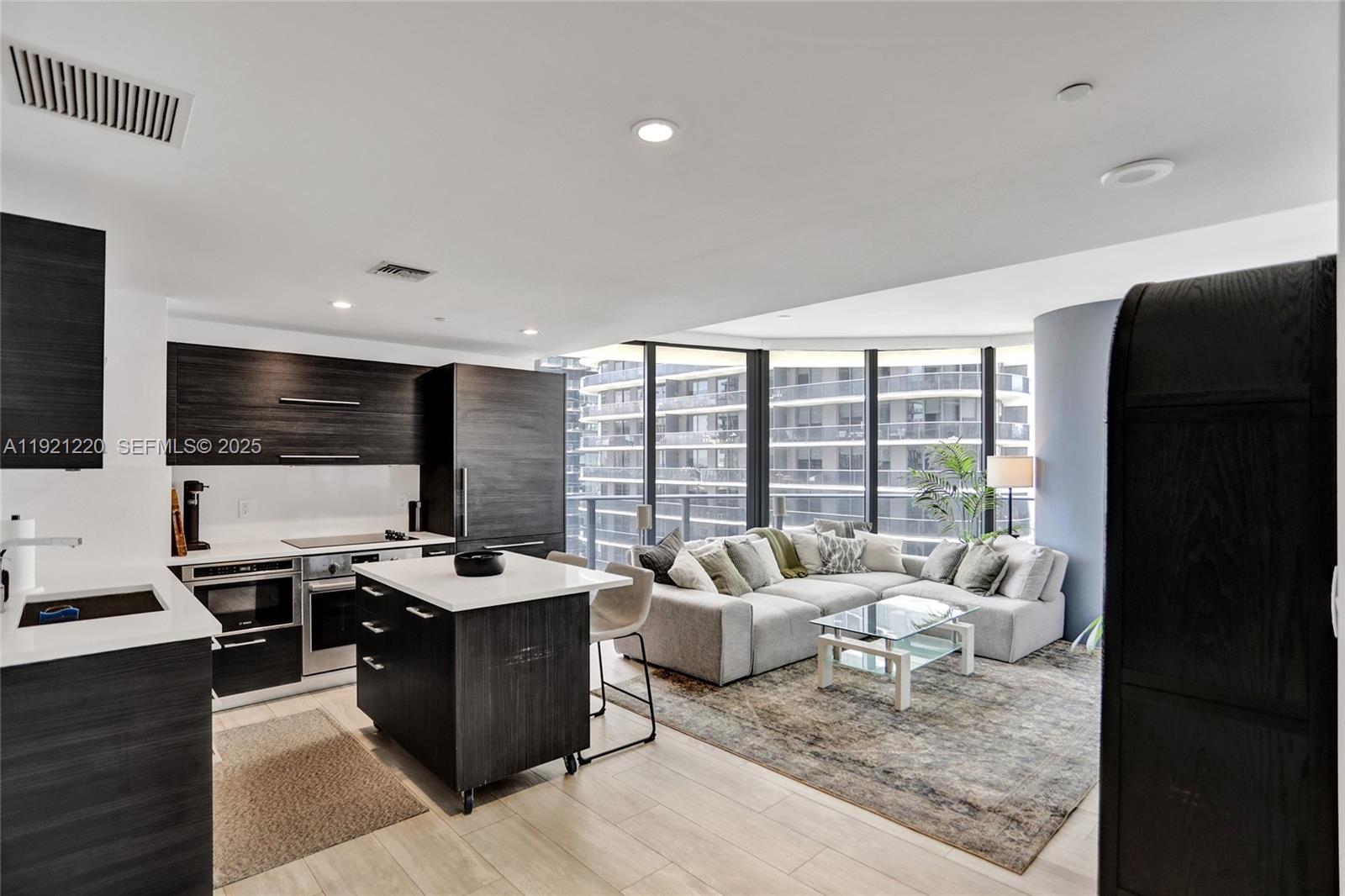 Stunning 2bdrm, 2bath condo located in Brickell Heights. This fully furnished unit offers a blend of luxury & comfort, perfect for those seeking a sophisticated urban lifestyle. Step inside to discover a beautifully designed living space, featuring elegant furniture that complements the modern aesthetic of the condo. The open floor plan seamlessly connects the living, dining, and kitchen area, creating a spacious environment ideal for entertaining or relaxing. Enjoy partial water views from the wraparound balcony, & the state-of-the-art Sonos surround sound system. Bdrms are generously sized, with fully built-in closets. 1 parking space included. Building offers full amenities including: rooftop pool, gym, sauna & more! Located in a prime area- across the street from Brickell City Centre.