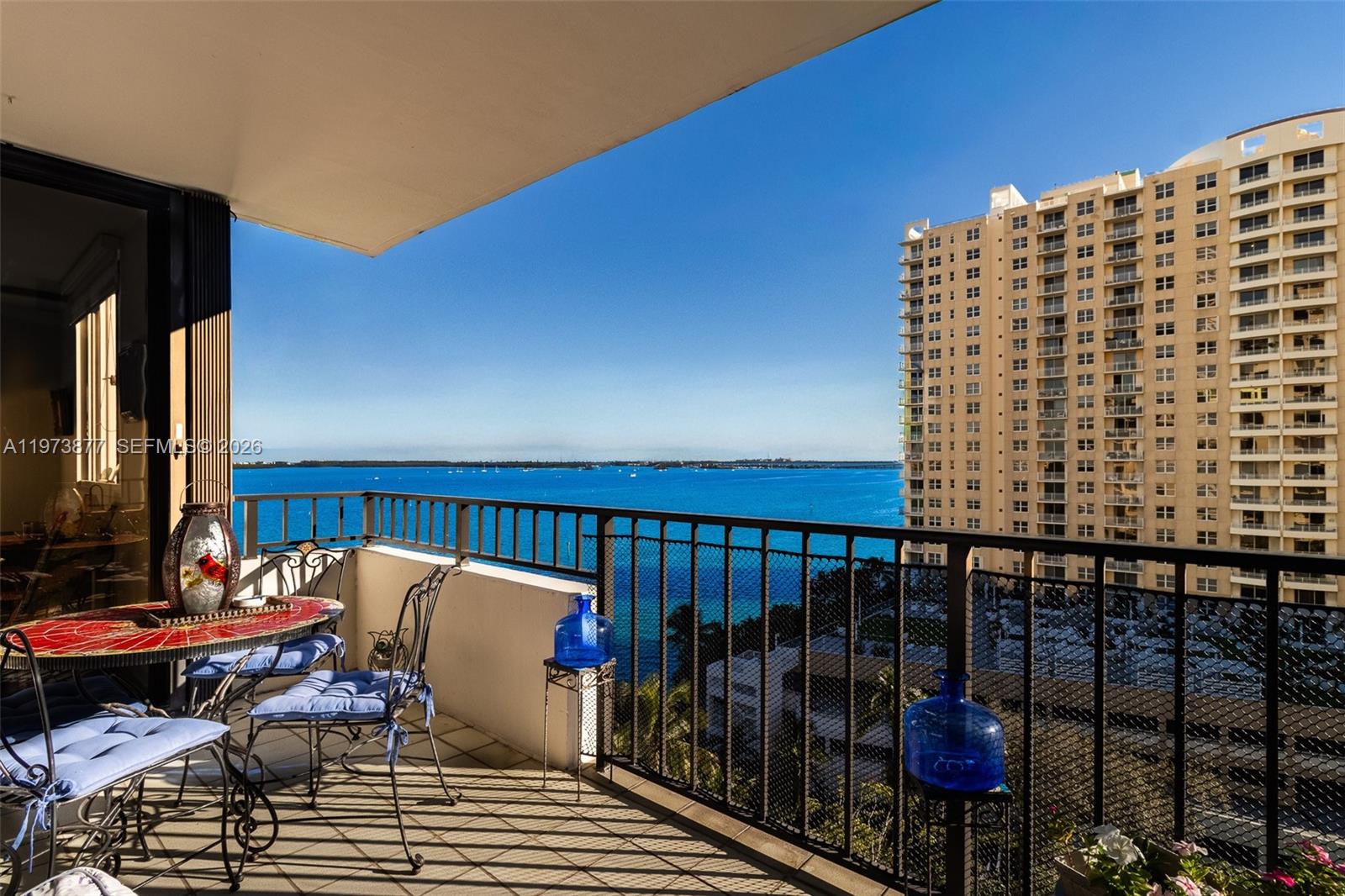Coveted 07-line residence on the 10th floor of exclusive Brickell Key, offering unobstructed water and skyline views of Biscayne Bay and Miami’s financial district. This bright 2-bedroom, 2-bathroom apartment features an open layout and a private balcony with stunning city and bay vistas — the perfect setting to enjoy passing boats and breathtaking sunsets.
The unit has been thoughtfully renovated and offers a modern kitchen with white cabinetry, granite countertops, and stainless steel appliances. Marble floors throughout the main living areas and wood flooring in the bedrooms add warmth and continuity. Both bathrooms have been updated, and the home includes in-unit washer and dryer, excellent closet space, and abundant natural light.
Located on gated Brickell Key, residents enjoy a true island lifestyle just minutes from Brickell City Centre and Downtown Miami. Amenities include a waterfront walking path, pool, tennis courts, fitness center, tropical gardens, on-site market, and dining. 40 year certification completed. Ideal as a primary residence, second home, or investment opportunity.