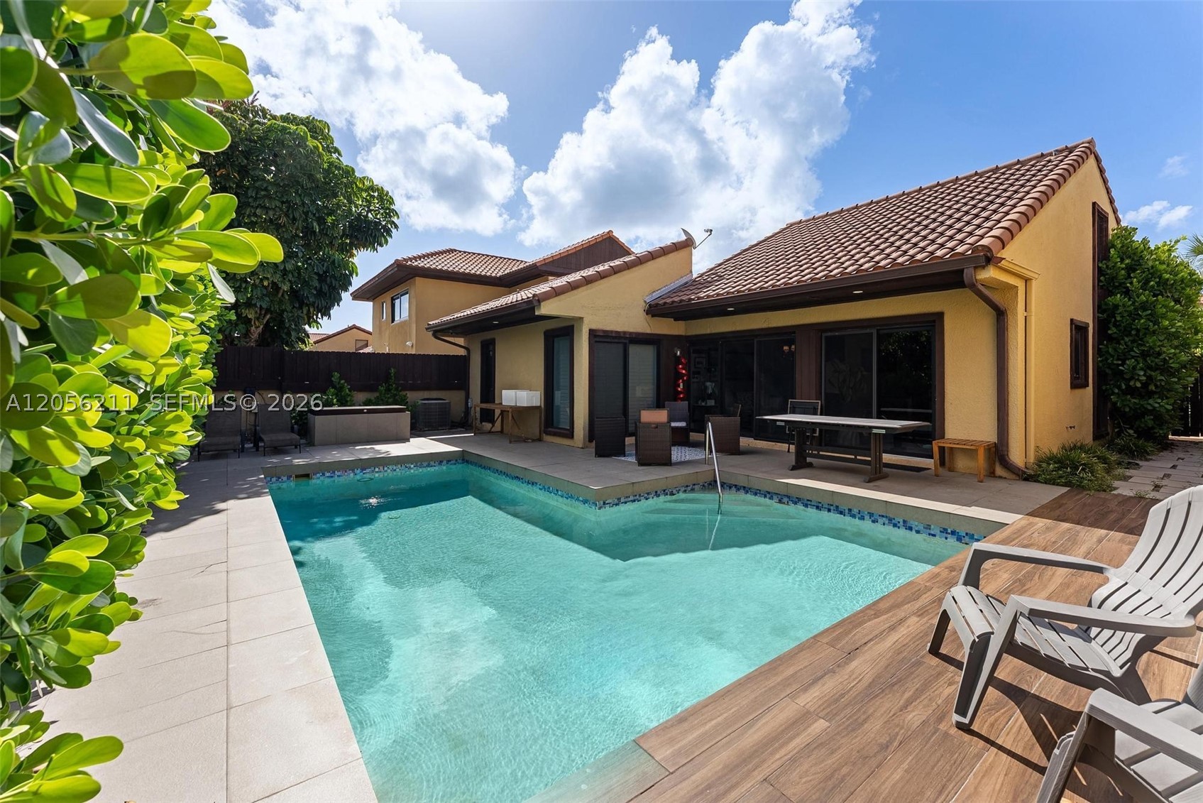 Discover elevated Miami living in this beautifully updated three-bedroom, two-bath residence located within the gated Sky Lake community, just minutes from Aventura.

Designed for both comfort and entertaining, the home features a private, fully fenced backyard with an expansive pool area—an inviting setting for relaxing, hosting guests, or enjoying Miami’s year-round outdoor lifestyle.

Inside, sleek porcelain tile flooring creates a refined and cohesive flow throughout the residence. The thoughtfully designed layout offers three generously sized bedrooms, including a spacious primary suite, along with newly renovated bathrooms finished with a clean, contemporary aesthetic.

Additional enhancements include impact-resistant windows and doors, an upgraded laundry room, smooth ceilings, and a two-car garage, seamlessly combining modern convenience with sophisticated design.

Ideally positioned near the beach, major highways, premier shopping, dining, and Aventura Mall, this exceptional home offers the privacy of a residential retreat with effortless access to everything Miami has to offer.