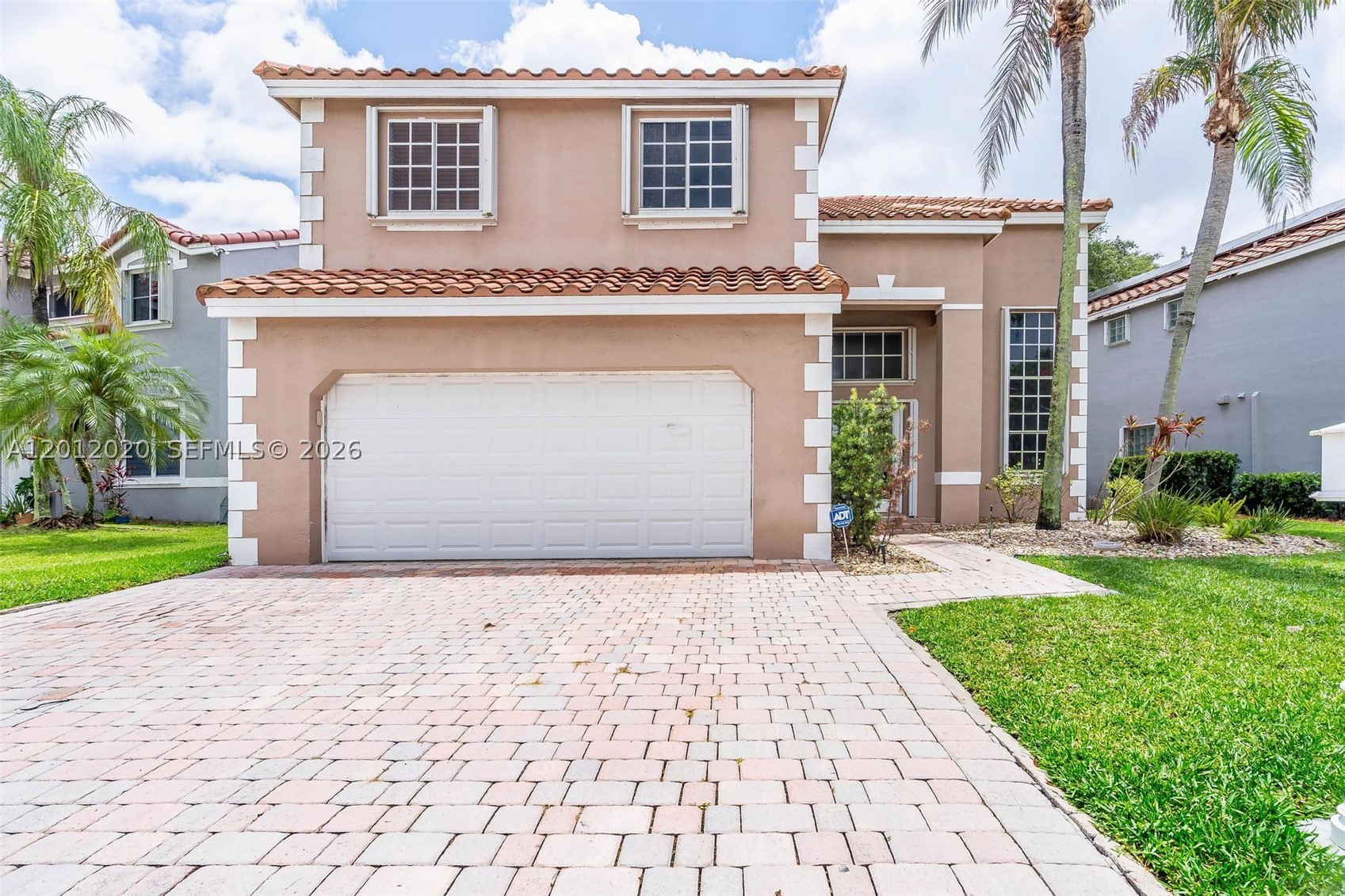 Step into luxury in this highly renovated 4-bedroom, 2.5-bath two-story residence located in one of Weston’s sought-after gated communities. Freshly painted and beautifully redesigned with upscale touches throughout, this stunning home features elegant wood-look tile flooring, high-volume ceilings, designer lighting, and sophisticated modern finishes. The luxurious new chef’s kitchen showcases quartz countertops, custom cabinetry, new stainless-steel appliances, and an open-concept layout perfect for entertaining and everyday living. Spacious formal living and dining areas flow seamlessly into the family room, creating an inviting and refined atmosphere. Upstairs, the oversized bedrooms and spa-inspired renovated bathroom offer comfort and style, while the primary suite provides a peaceful retreat. Enjoy outdoor living with a beautifully paved patio and hot tub, ideal for relaxing or hosting guests. Additional highlights include a paver driveway, 2-car garage, barrel tile roof, accordion hurricane shutters, low HOA, and walking distance to the community pool and top-rated schools. This move-in-ready home combines elegance, comfort, and the best of Weston living. One or more photos have been digitally staged. 2nd photo digitally enhanced to illustrate potential appearance. Price Reduced for a Quick Sale! Highly just renovated with luxury finishes—schedule your showing today!