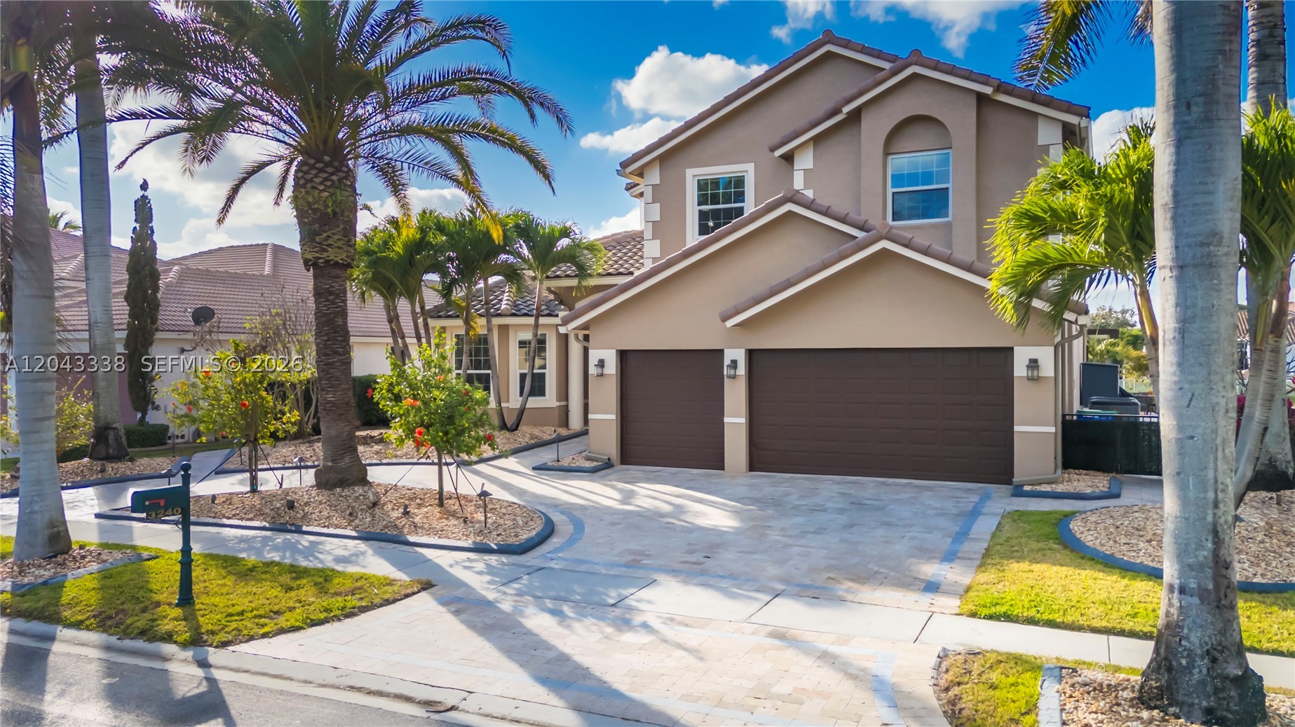 Move-in ready luxury lakefront pool home in the guard-gated community of Sunset Lakes with nearly half a million in upgrades, including a NEW ROOF, full IMPACT WINDOWS & DOORS, and a high-efficiency Lennox 28 SEER HVAC system. This beautifully updated home offers 4 bedrooms plus a spacious loft, ideal as a 5th bedroom, home office, or extra room, 4 full bathrooms, soaring volume ceilings, and an open floor plan filled with natural light. The remodeled chef's kitchen features quartz countertops, ceiling-height cabinetry with pull-out storage, a large center island, walk-in butler's pantry with additional cabinetry, and LG Signature stainless steel appliances including double wall ovens and a convection microwave. The luxurious primary suite offers custom walk-in closets and a private balcony overlooking the lake. Enjoy your backyard oasis with a sparkling pool, travertine patio, screened lanai, and a 20x20 pergola with motorized sun and bug screens. Additional upgrades include a spa-inspired primary bathroom, renovated laundry room with quartz countertops, custom blinds, finished garage with epoxy floors, overhead storage, EV charging outlet, whole-house gutters, smart switches, and lake-fed irrigation. Sunset Lakes offers resort-style amenities including a clubhouse, fitness center, tennis, pickleball, basketball courts, playgrounds, and 24/7 guarded security. HOA includes cable and internet. Ask me about our exclusive 2.25% ASSUMABLE LOAN!!
