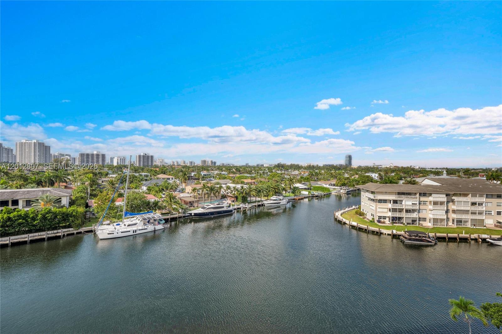 Bright and spacious corner unit featuring 2 bedrooms and 2 bathrooms in the heart of Hallandale Beach. This residence offers ceramic flooring throughout, abundant natural light, and a large wraparound balcony with views of the bay and pool area. Functional split floor plan with spacious living and dining areas, ideal for full-time residence or seasonal use.
Well-maintained building with amenities including pool, fitness center, sauna, lounge room, and on-site management. Conveniently located near beaches, shopping, dining, parks, and major highways. Pet-friendly building. Building has completed the 40-year certification and is currently undergoing the 50-year recertification process. Great opportunity to own in a desirable waterfront community.