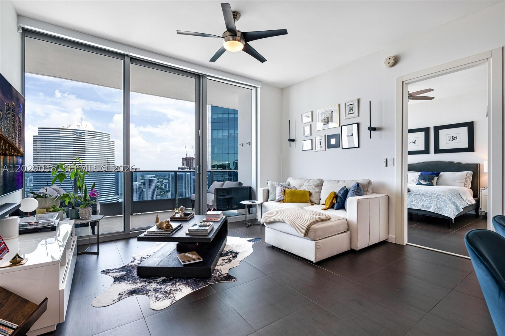 Perched high above downtown Miami, this one-of-a-kind penthouse at Epic delivers the kind of views people move to this city for. Watch the river meet the bay and the skyline light up from a private, oversized balcony that feels like your own front-row seat to Miami.
Inside, a meticulously updated split layout offers 2 bedrooms, 2.5 baths, and a versatile den ready to become a home office or third bedroom. Ten-foot ceilings give every room a sense of scale, while floor-to-ceiling light pours across top-of-the-line porcelain flooring.
The kitchen is built for someone who actually cares about the details, with Miele and Sub-Zero appliances and not one but two wine fridges. The bathrooms are finished in marble, with an exquisite primary bath featuring a separate shower and a washer and dryer relocated for everyday ease. Custom built-out closets and automated window treatments round out a home where nothing was left to chance.
Ownership comes with one assigned parking space, and valet. A private 100 square foot air-conditioned storage unit on the same floor, a rare convenience at this level can be negotiated with the unit as well. Add in the full Epic lifestyle, with a secured lobby, five pools, two waterfront restaurants, and a bar, all steps from your door.
Penthouse living in the heart of Miami, finished and ready for its next owner.