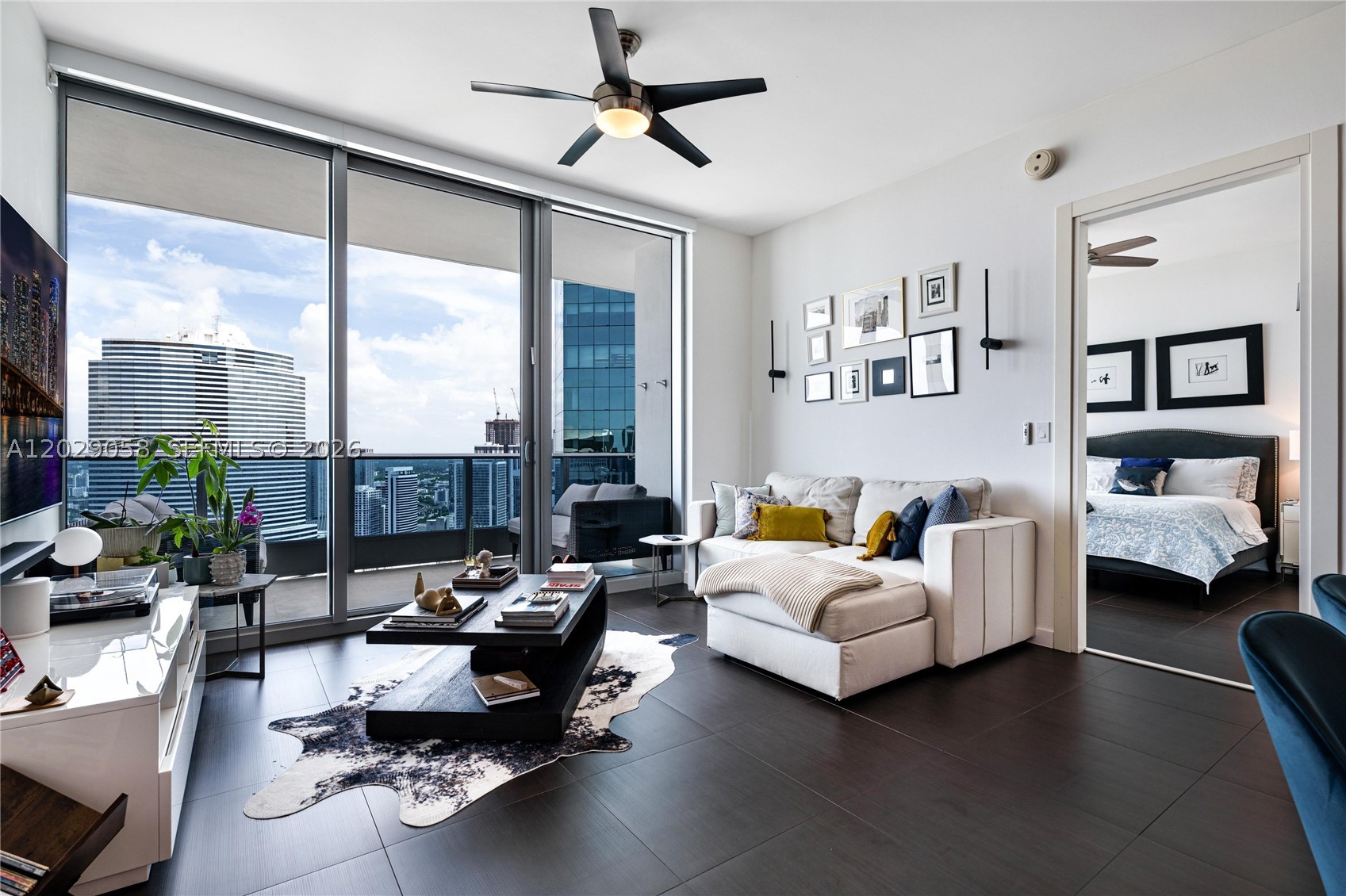Perched high above downtown Miami, this one-of-a-kind penthouse at Epic delivers the kind of views people move to this city for. Watch the river meet the bay and the skyline light up from a private, oversized balcony that feels like your own front-row seat to Miami.
Inside, a meticulously updated split layout offers 2 bedrooms, 2.5 baths, and a versatile den ready to become a home office or third bedroom. Ten-foot ceilings give every room a sense of scale, while floor-to-ceiling light pours across top-of-the-line porcelain flooring.
The kitchen is built for someone who actually cares about the details, with Miele and Sub-Zero appliances and not one but two wine fridges. The bathrooms are finished in marble, with an exquisite primary bath featuring a separate shower and a washer and dryer relocated for everyday ease. Custom built-out closets and automated window treatments round out a home where nothing was left to chance.
Ownership comes with one assigned parking space, and valet. A private 100 square foot air-conditioned storage unit on the same floor, a rare convenience at this level can be negotiated with the unit as well. Add in the full Epic lifestyle, with a secured lobby, five pools, two waterfront restaurants, and a bar, all steps from your door.
Penthouse living in the heart of Miami, finished and ready for its next owner.