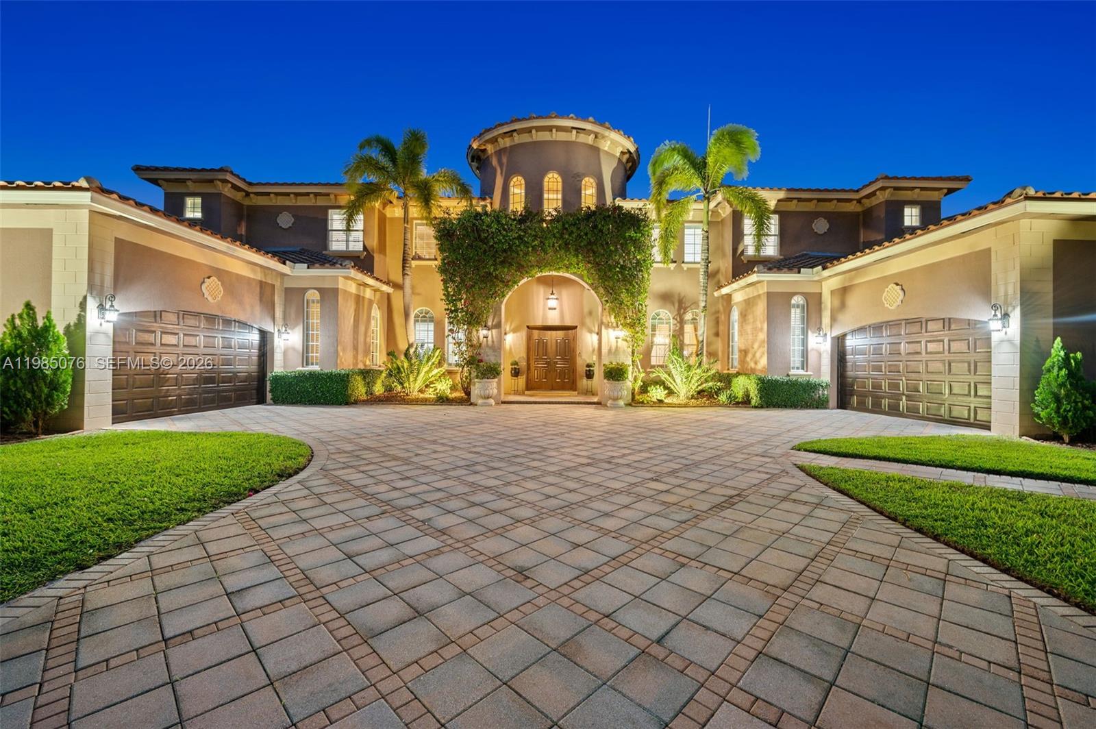 Luxury estate home in prestigious Stonebrook Estates offering over 6,540 sq ft of living space on a private 42,000+ sq ft lot. This 6-bedroom, 7.5-bath residence affords a well-designed floor plan with a spacious primary suite on the main level, den and a luxurious bathroom with a Roman tub, oversized shower, & dual water closets. Large windows thru-out fill the home with abundant natural light. The open-concept kitchen features a Sub-Zero refrigerator/freezer, double oven w/warmer, and flows seamlessly into the dining area and family room. Saturnia marble flooring, solid wood interior doors, and French doors add to the home’s elegance.  Designed for both comfort and entertaining, the main level also includes a media room w/new leather power recliners, half bath and an en-suite guest bedroom providing privacy for visitors.  The second floor offers four bedrooms, each with en-suite baths, along with a spacious loft. Dual laundry rooms on both levels add convenience.  Outdoor living includes a covered patio w/471 sq ft), resort-style pool and spa, and a private backyard with a full working summer kitchen.  Other features include impact windows and doors, full wet bar with refrigerator & ice maker, central vacuum, Updates include two water heaters (2021), three A/C units (all under 5 years old), and a roof replaced in 2017. Four-car garage w/split design. Community offers 24-hour manned gate, tennis/pickleball/basketball/volleyball courts, fitness center & clubhouse.