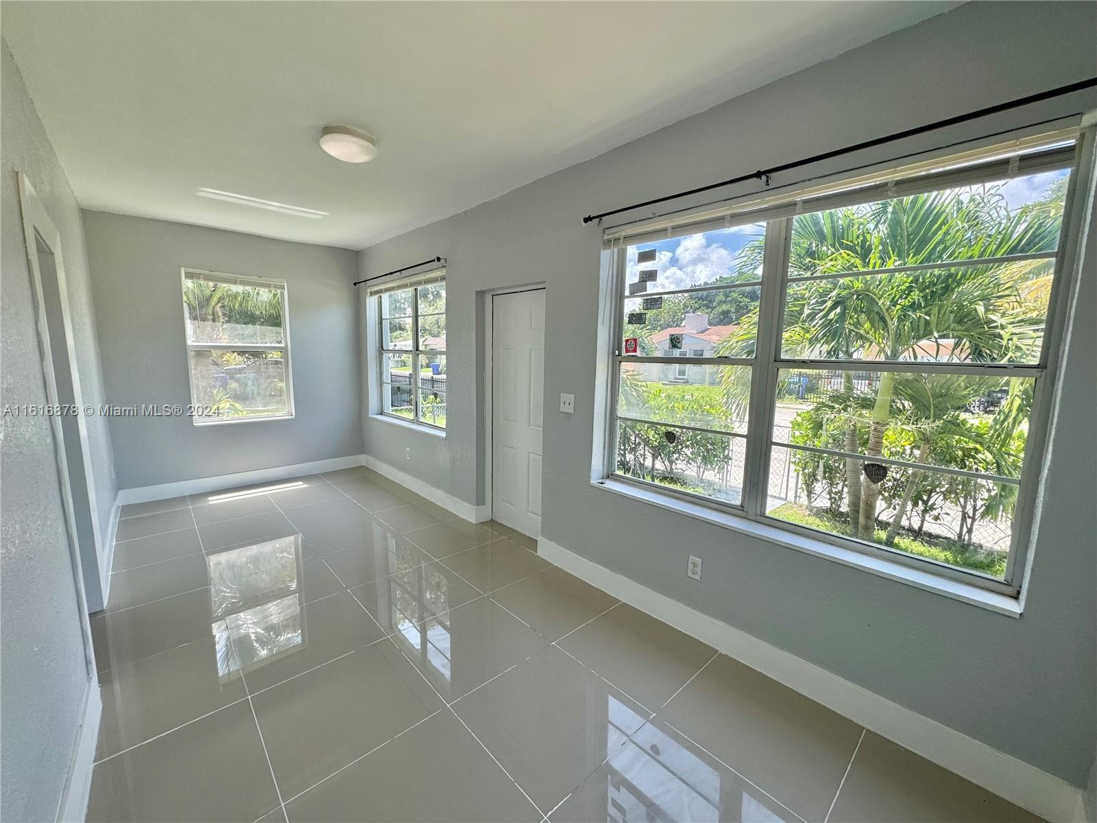 Magnificent Renovation! Gorgeous three bedroom and two bath! Complete restoration. New fireplace, new paint, new central a/c unit and washer and dryer! Covered parking! Dogs are accepted. Centrally located minutes to Wynwood, Design District, Midtown, and Downtown! 2 security deposits and the first month to move in.