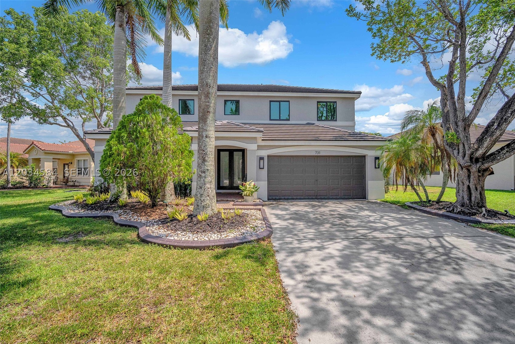 Meticulously maintained and extensively updated 4BR/2.5BA residence situated on an oversized homesite in Savanna, one of Weston's most sought-after communities. Thoughtfully improved with attention to detail throughout, recent upgrades include a new roof (2023), impact windows and doors (2025), luxury laminate flooring throughout (2024), interior paint (2024), exterior paint (2023), remodeled primary bathroom (2025), water heater (2025), whole-house water filtration system (2024), and extensive backyard enhancements completed in 2025 including travertine hardscaping, pergola, podocarpus privacy hedge, and new awnings. The fully fenced backyard offers ample room for a future pool. Additional features include KitchenAid Pro Line appliances, Samsung refrigerator (2023), smart lighting, centralized vacuum system, double entry doors, epoxy-coated garage floor, EV charging outlet, smart toilet in the primary bath, 2-car garage, and driveway parking for up to 4 vehicles. A rare opportunity to acquire a move-in ready home with a level of updating, lot size, and overall presentation not commonly found within the community.