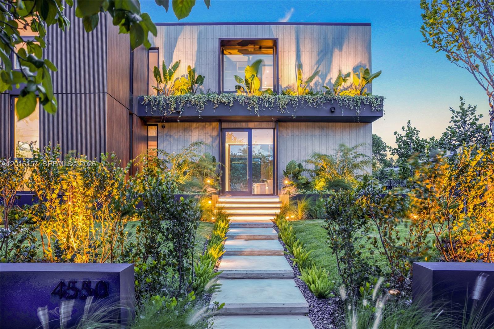 Stunning modern residence in the heart of Miami Beach offering approximately 4,000 SF of interior living space and 4,700 SF total area. This exceptional 5-bedroom, 5.5-bathroom home showcases top-tier finishes and meticulous custom craftsmanship throughout. The property features fully custom millwork including a designer kitchen equipped with top-of-the-line appliances such as Miele and a premium Forno Galiano cooktop, elegant wall paneling, built-in closets, and custom floor-to-ceiling frameless interior doors. Premium materials elevate every space, with sleek limestone flooring on the first level and beautiful Italian engineered wood floors upstairs. The home’s lighting was thoughtfully designed by a professional lighting designer, enhancing architectural details and creating a warm, sophisticated ambiance throughout. Designed for both comfort and sophistication, the home includes smart home technology and a bright, open layout ideal for modern living and entertaining. Step outside to a spectacular pool area featuring a waterfall for a relaxing ambient sound and a jacuzzi, creating a true private resort-style experience. Expansive front yard space enhances the home’s presence, while the fully fenced property offers privacy and security.