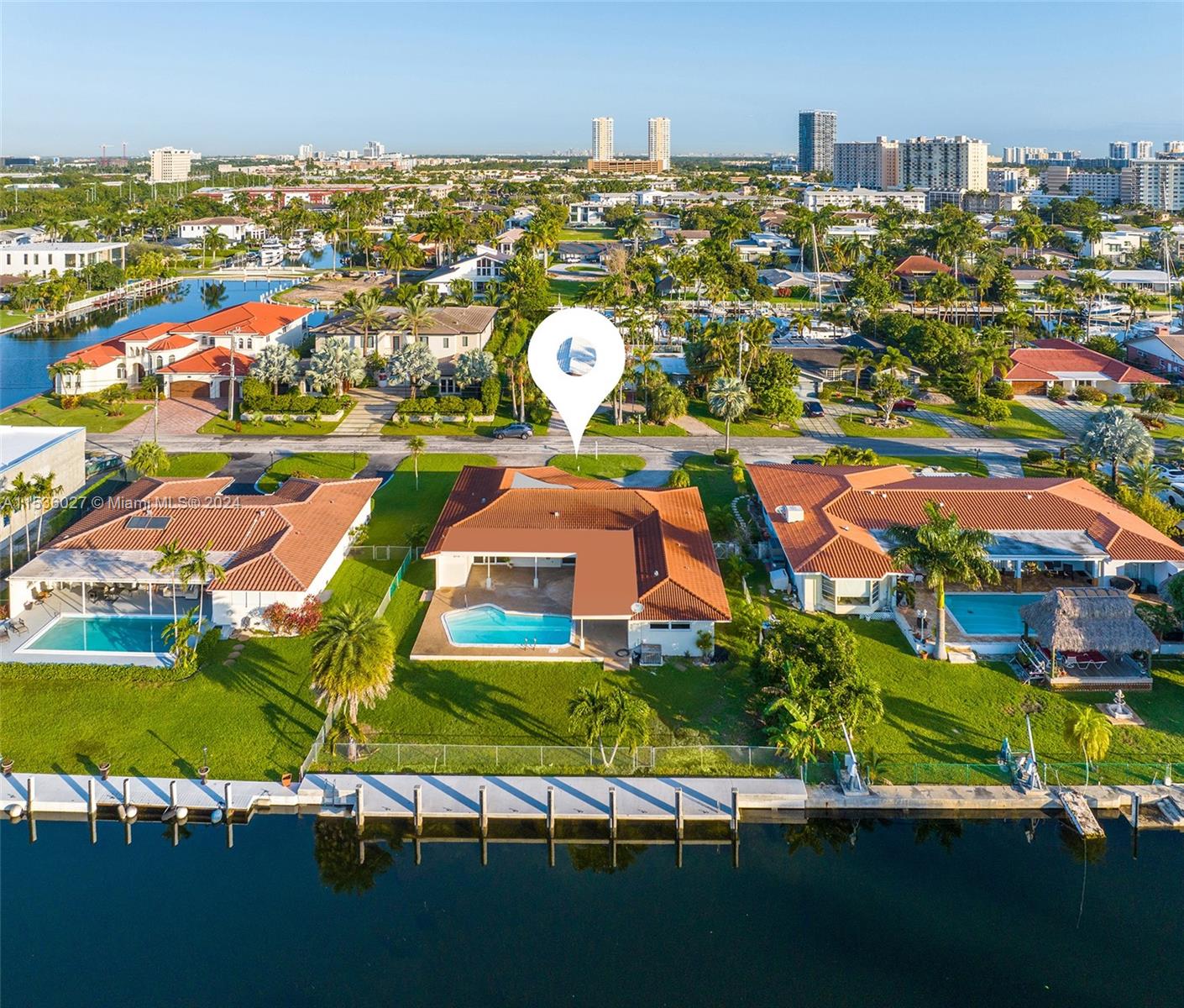 Golden Isles waterfront property with 83’ of water frontage and seawall / dockage on a 12,450 sq. ft. lot. This property has southern exposure on deep water, no fixed bridge with ocean access. Mostly original home, this 3 bedroom, 3 baths house can easily be rental while you're obtaining permits to build a new home.  Golden Isles is a boater’s paradise due its’ wide canals with turning basin along with its location between both Miami and Fort Lauderdale. Get ready to build your new waterfront estate.