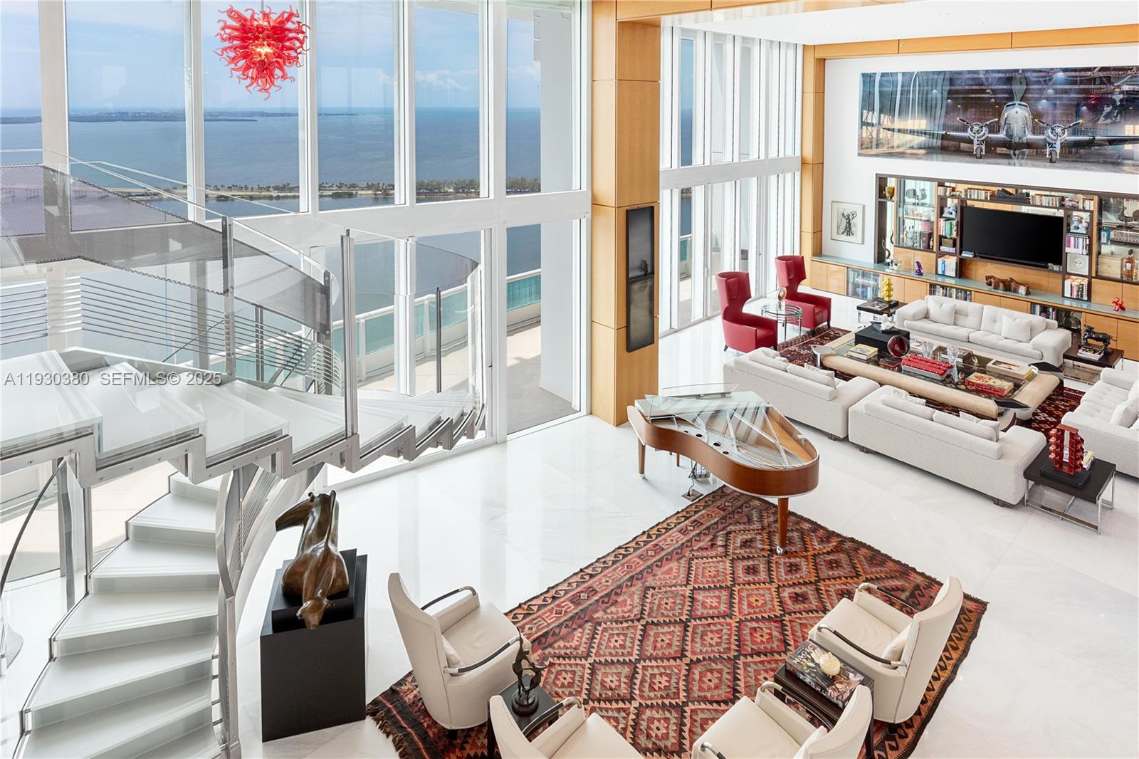 Rare opportunity to own an almost 15,000 SqFt waterfront Duplex PH on the 49 and 50 Floors with your own 97 Ft dock for your yacht and private rooftop terrace pool. Originally 7 bedrooms, remodeled, and currently configured as 3 primary bedrooms each with dual baths and sitting areas, can be easily converted back to increase bedrooms. The main primary bedroom features its own wing and spans over 1,800 SqFt. This architectural masterpiece faces East, North, and West, features double height ceilings, floor-to-ceiling windows, fully unobstructed 270-degree views of Biscayne Bay, Atlantic Ocean, islands of Miami Beach, Miami's skyline and beyond from every corner, and is designed for seamless entertainment. Santa Maria is an iconic building located in the estate section of Brickell where the new St Regis is being built immediately to the South (will not cover this unit’s view), offering 24/7 security, guard gated entry, tennis court, Health Club, gym, spa, restaurant, pool, resident’s marina, event space, and more remodeled resort style amenities and services. The building’s lot size is unmatched and although a high rise, unit count is considered boutique. All while being within a short walk to gourmet restaurants, upscale shopping and entertainment in the heart of Brickell, and a short drive to Coconut Grove, Miami Beach, Key Biscayne, and the Design District. All assessments for the unit have been paid by seller. Lives as waterfront single family house with condo conveniences.