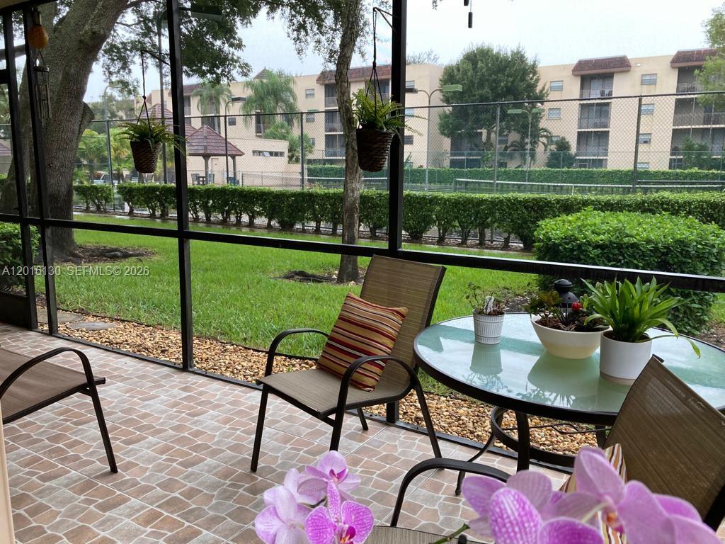 Beautiful First-Floor Corner Apartment featuring 3 Bedrooms and 2 Full Bathrooms. Updated Kitchen with Stainless Steel Appliances and Breakfast Area.  Washer/Dryer Hook-Up in unit.  Enjoy a Large Patio with Peaceful Garden and Tennis Courts Views.  Accordion Shutters!!  Well-maintained Community offering a Clubhouse, Pool, Spa, and Playground.  Excellent Location and Opportunity for Comfortable Living!!!