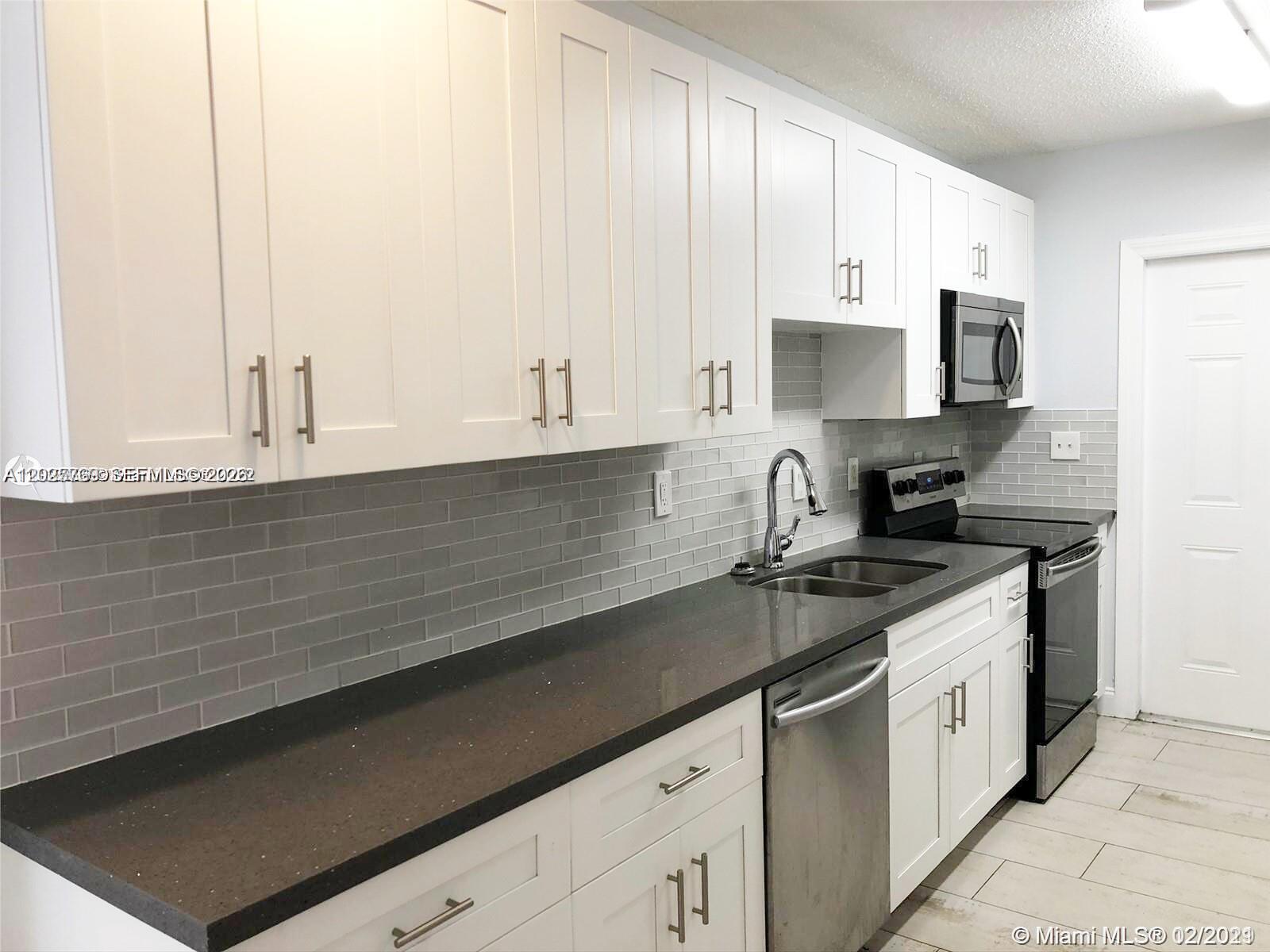 Huge unit three bedrooms three bathrooms in centrally located Fort Lauderdale!! Three plus parking spaces. Separate laundry room and washer and dryer. It won't last!