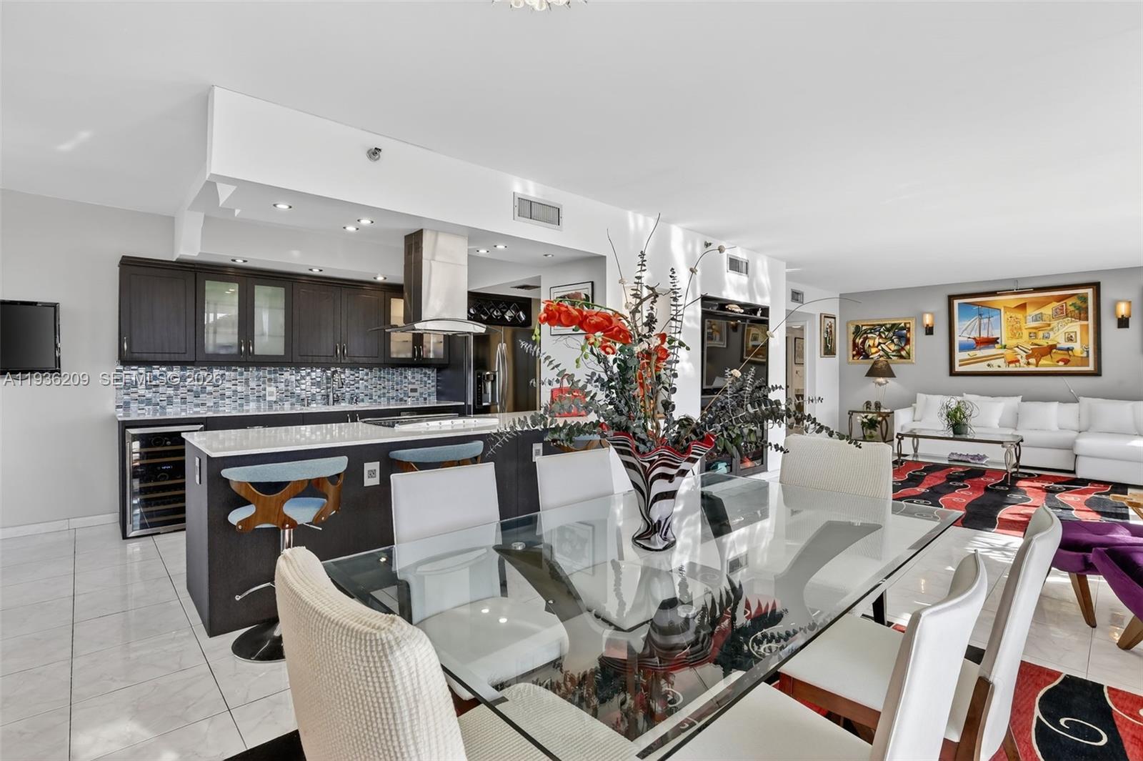 Fabulous stunning renovated modern residence in Hamptons West. New New New! Enter this corner residence through double doors into a spacious 1,800 sq ft interior space, 2 bed rooms 2 bathrooms with 2 large newly renovated glass terraces. Amazing for entertaining with new state of the art “open” concept. Contemporary kitchen with newly designed large pantries and all solid wood cabinets, quartz countertops and frost glass doors. All new modern marble bathrooms in this split floor plan that offers complete privacy with imported cabinets, jacuzzi bathroom and shower with multiple shower heads. Artisans and craftsmen created a work of art. Custom new ample LED lighting throughout. This is your opportunity to live in the prestigious Hamptons community which offers endless amenities.