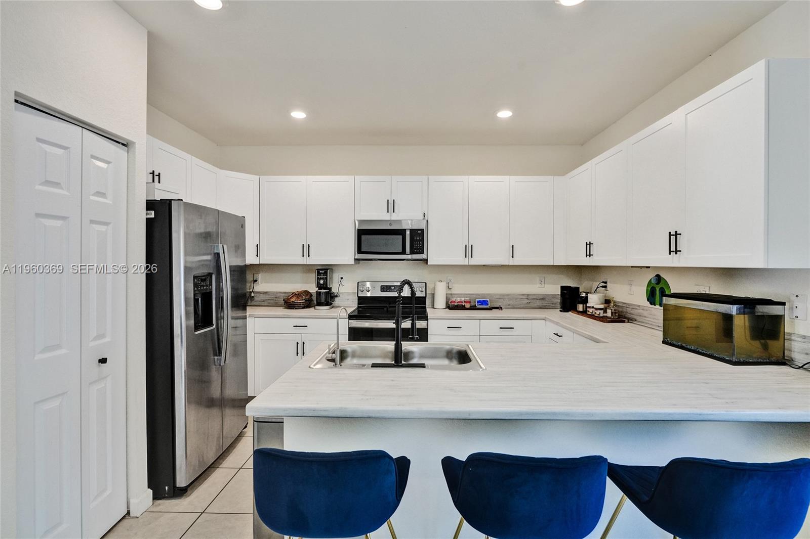 One of the few homes in Aquabella featuring solar panels and a whole-house water filtration system, offering added efficiency, comfort, and long-term value. This well-maintained 2021 townhouse located in the gated Aquabella community in Hialeah Gardens offers 3 bedrooms, 2.5 bathrooms, and a functional layout designed for comfort and everyday living. The home features an open-concept kitchen with contemporary cabinetry, ample counter space, and seamless flow into the dining and living areas, creating an ideal setting for both daily living and entertaining. Enjoy a private patio with installed flooring, perfect for outdoor relaxation and gatherings. The property also includes two assigned parking spaces conveniently located directly in front of the unit. Located near major highways, shopping, dining, schools, and an area experiencing continuous commercial growth with new retail and lifestyle developments nearby. Resort-style community amenities and excellent accessibility make this property a great opportunity for buyers seeking comfort, convenience, and added value in today’s market.