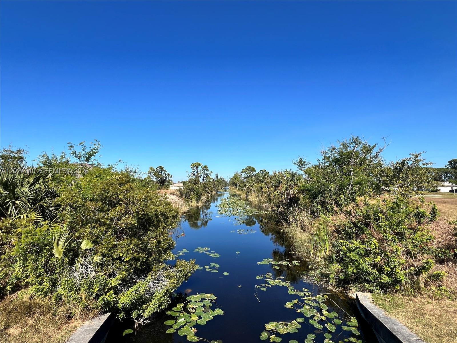 Prime residential corner lot in North Cape Coral (cash only). Build your dream home or investment property on this flat, cleared canal lot in North Cape Coral's growing residential district. This corner property offers exceptional potential in an established, family-friendly neighborhood with no HOA restrictions. Minutes from shopping, dining, schools, and recreation, including golf courses, parks, and boating facilities. Easy access to Fort Myers, Southwest Florida International Airport, and major highways. Ideal for a primary residence or investment in a rapidly developing area known for canals and outdoor lifestyle. Cash offers only.