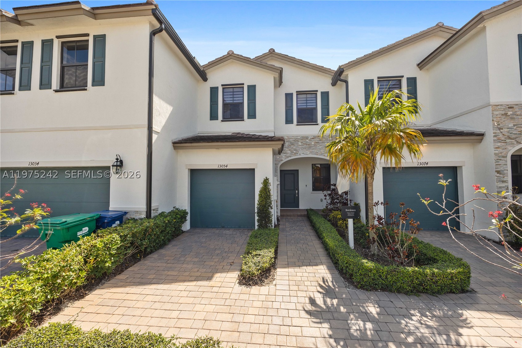 South Florida living at its best! This former builder model has never been lived in and is perfect as a starter home, second home, or investment. The 3BR/2.5BA layout offers modern comfort with a sleek kitchen featuring stainless steel appliances, a fenced rear yard, and a spacious primary bath with walk-in shower. Furniture not included but negotiable. Enjoy affordable HOA fees and great amenities including a clubhouse, fitness center, pool, and tot lot. Square footage approximate.