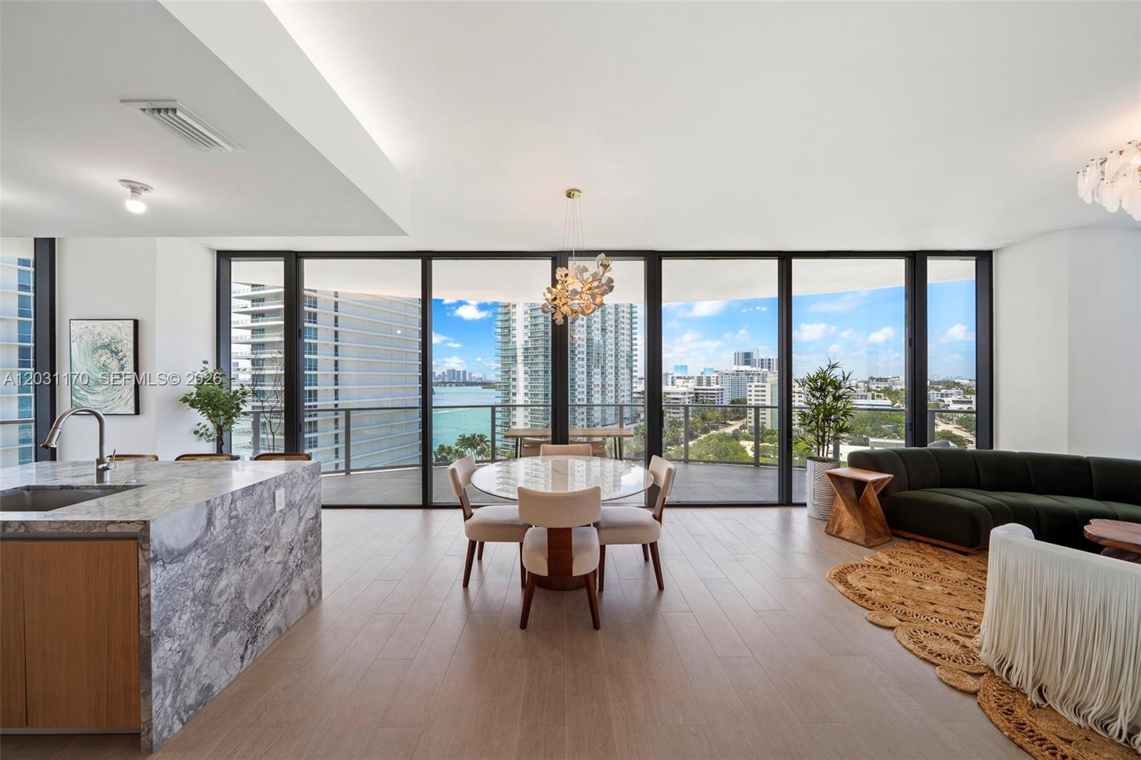Available immediately for yearly lease. Experience elevated Miami Beach living in this spectacular corner two-bedroom residence at Five Park. Featuring over 800 square feet of wraparound terrace space, Residence 1205 offers expansive east, north, and west exposures with sweeping views and exceptional natural light throughout the day. The thoughtfully designed split floorplan includes a spacious living area and refined finishes throughout, including Gaggenau appliances, custom-made kitchens with white oak cabinetry and quartzite countertops, marble primary bathrooms, and soaring 10-foot ceilings with floor to ceiling windows. Delivered in Nov 2024, Five Park is a full service luxury building offering its residents resort-style amenities, including a private beach club with dedicated transportation to and from the property, two pools overlooking the bay, a poolside restaurant, bar and lounge, state-of-the-art wellness and fitness spaces with infrared sauna. Additional amenities include a co-working studio with private offices, screening room, children’s playroom, teen's game lounge, two house cars and an electric golf cart. Ideally located just moments from the beach, parks, world-class dining, and the best of Miami Beach living