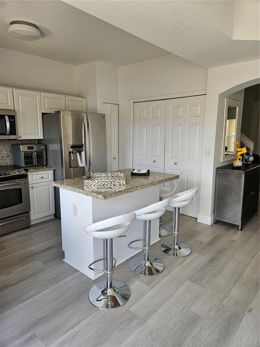 THE GATES AT DORAL ISLES - Residential Lease