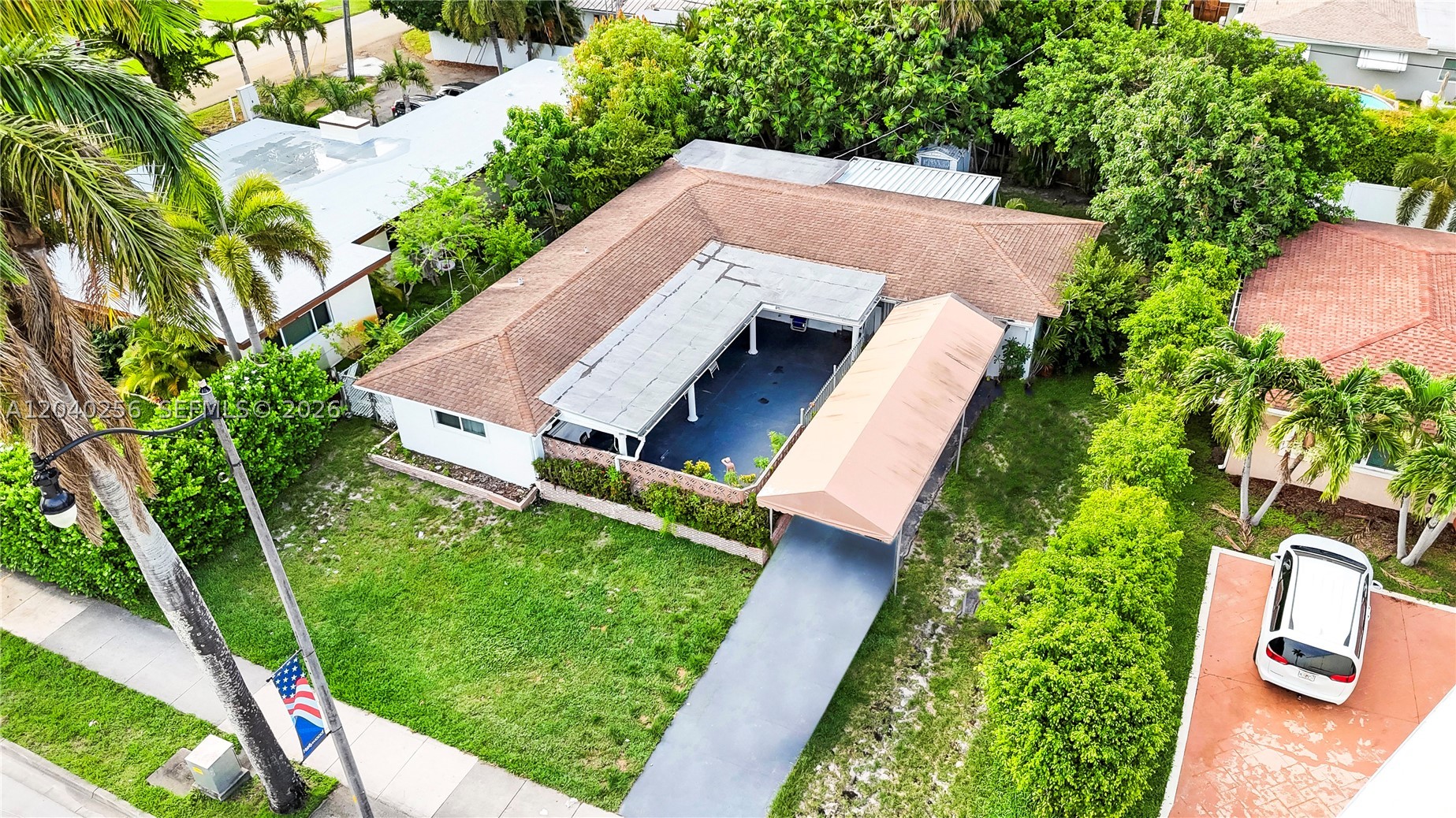 Where Income potential meets charm! This spacious home features tasteful updates in multiple rooms, impact windows, and a 5-year-old roof for lasting peace of mind. A thoughtfully converted garage adds versatility, ideal for guest quarters or rental income. The large open layout is ideal for entertaining, with a serene backyard anchored by a lush, fruit-bearing mango tree. Zoned for flexibility, this property is a great fit for both short- and long-term rental income. Centrally located near beaches, hospitals, exceptional schools, highways, and downtown Hollywood. A must-see opportunity for homeowners and investors alike!