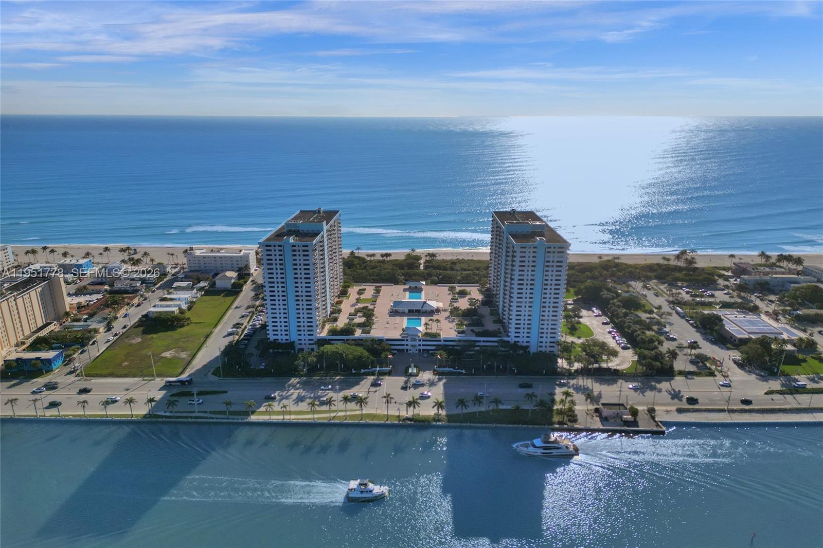 Enjoy the benefits of an established beachfront building in a neighborhood poised for continued growth—making this condo a smart investment and perfect coastal retreat. Located at The Summit on Hollywood Beach between the Intracoastal and Atlantic Ocean, this updated, move-in ready 1-bed/1-bath unit features porcelain tile, impact windows, updated kitchen/bath, newer A/C and water heater, walk-in closet, and large balcony with Intracoastal views. Enjoy the convenience and privacy of 2nd-floor living with direct access to the lobby and same-level covered parking—no elevator required! Amenities: 2 heated pools, tennis, pickleball, gyms, saunas, BBQ, game rooms, libraries, private restaurant, and more. Steps to the Broadwalk, dining, nature parks, boat ramps, and water taxi. Easy to show.