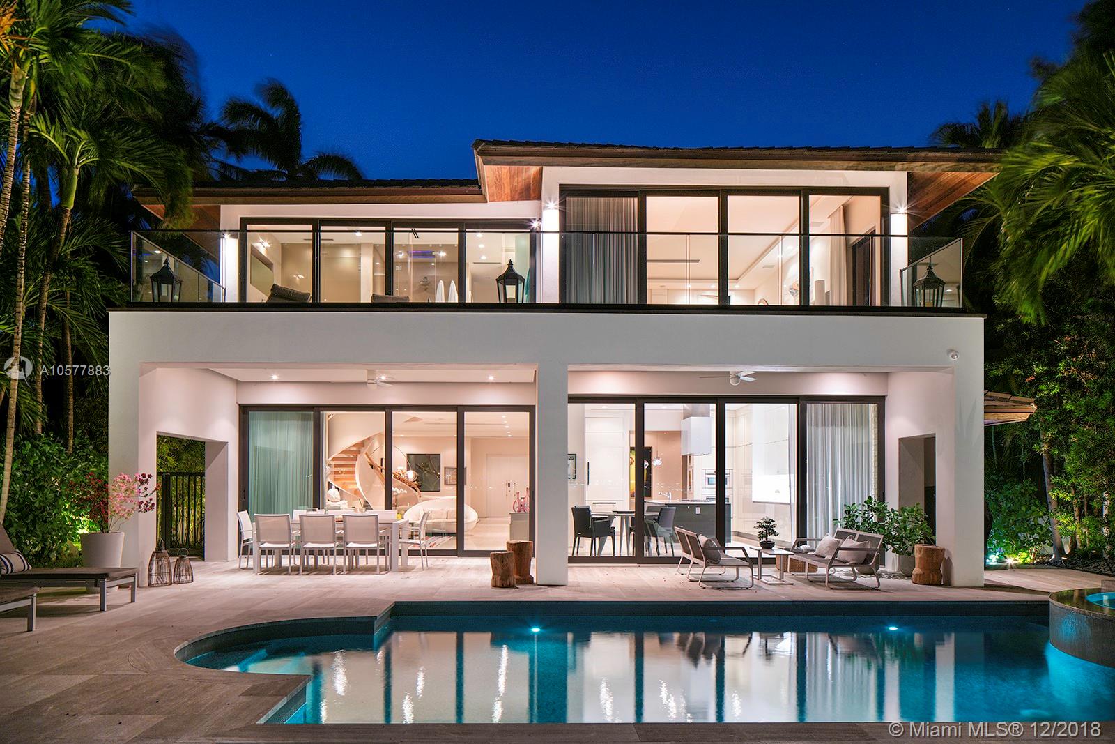 Influenced by the tropical design of its surroundings, this stunning modern waterfront home offers breathtaking bay views of Miami Beach through Telescopic floor to ceiling pocket sliding glass doors. Boasting an Italian kitchen & doors, Miele/SubZero appliances, Dornbracht bath fixtures and a Lutron lighting /Savant automated Smart system, enjoy serenity and privacy as you enter the residence through a beautiful courtyard surrounded by trees.