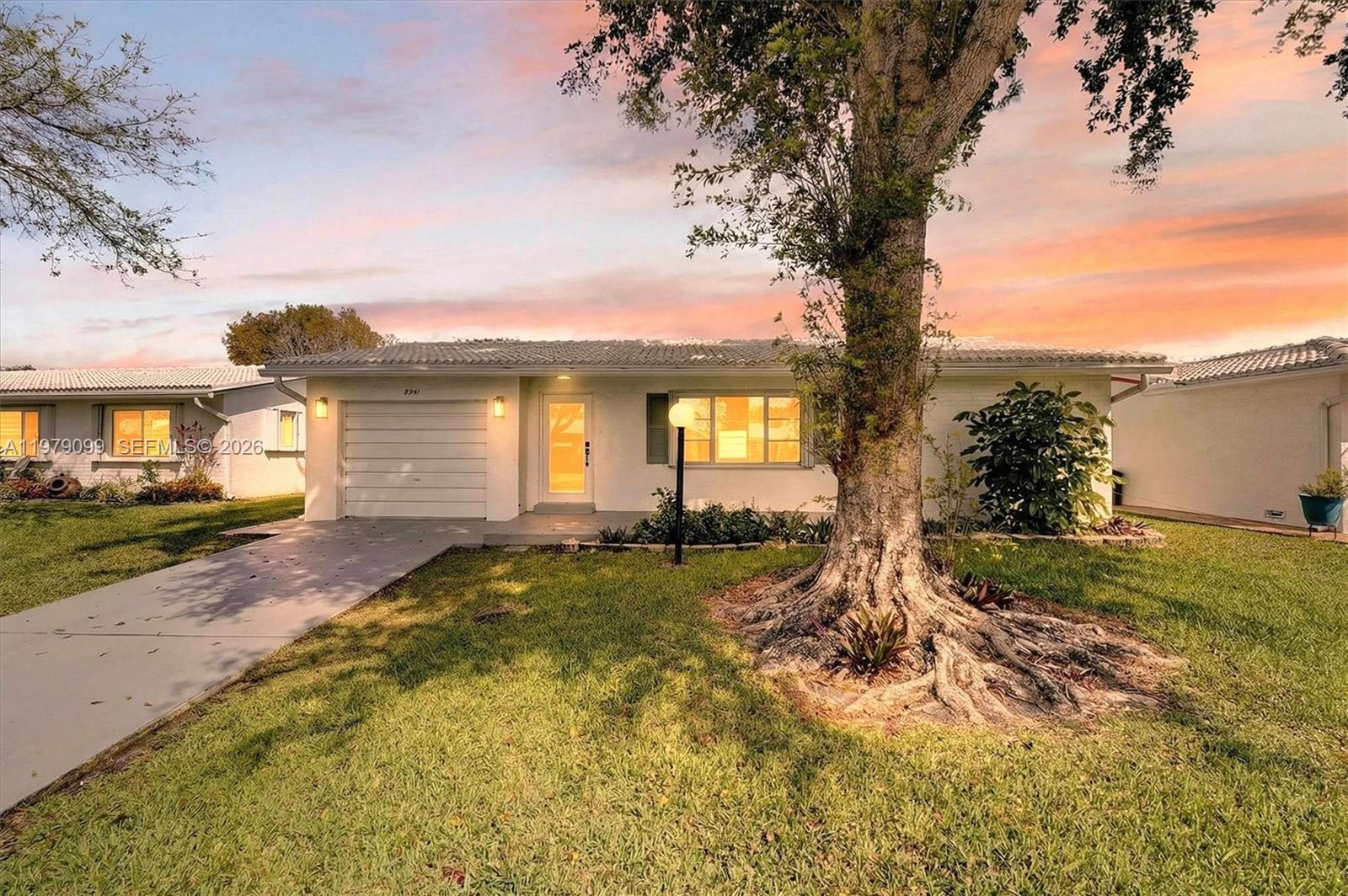 This beautifully remodeled, spacious (largest model in community) 3/2 garage home boasts modern European style cabinets, high quality vinyl plank flooring, brand new applicances including water heater, brand new upgraded electrical panel and wiring, roof and AC are 5 years old. The HOA covers the repair and replacement of the roof, exterior painting, lawn care, cable, exterior pest control, and all common areas. This is a 55+ community, where one occupant must be 55 or over, and all other occupants must be 18 and over. There is no leasing the first year of ownership. Dogs are not permitted unless they are service animals or emotional support pets. All supporting documentation will be required for HOA approval.

Lauderdale West provides residents with 2 clubhouses. The main clubhouse features indoor amenities such as an exercise room, sauna, card rooms, billiards room, library, ballroom, and arts and craft studio. There is an outdoor pool and spa, two bocce ball courts, and six shuffleboard courts. 
The 2nd clubhouse has a multi-purpose room, sauna, outdoor pool, & 3 tennis courts. Lauderdale West also provides residents with community shuttle service.