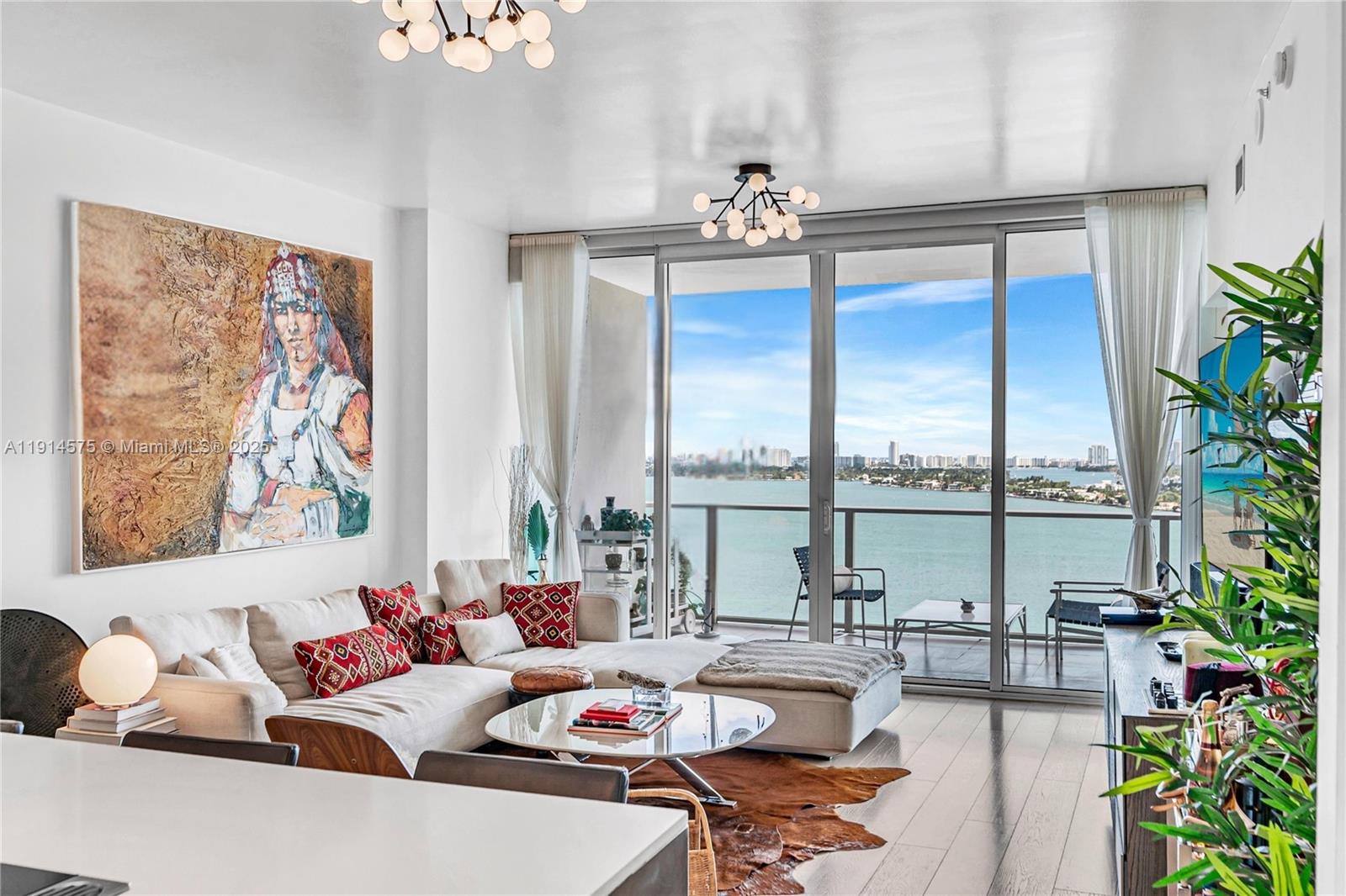 Experience refined waterfront living in this expansive unit showcasing breathtaking, direct bay views from one of Edgewater’s most prestigious bayfront addresses. This elegant 2 +
den home has been tastefully upgraded with custom Italian doors, rich wood flooring, and a suite of premium Gaggenau appliances. Private elevator foyer, thoughtful layout with a
spacious laundry room, generously sized bedrooms, walk-in closets, and two sweeping balconies that capture uninterrupted vistas of the water and the city skyline. Perfectly
positioned near Margaret Pace Park, Downtown, Wynwood, and Miami Beach, Paramount Bay offers a premier location complemented by resort-style amenities including sunrise
and sunset pools, jacuzzi, full-service spa and fitness center, theater, and 24/7 concierge.