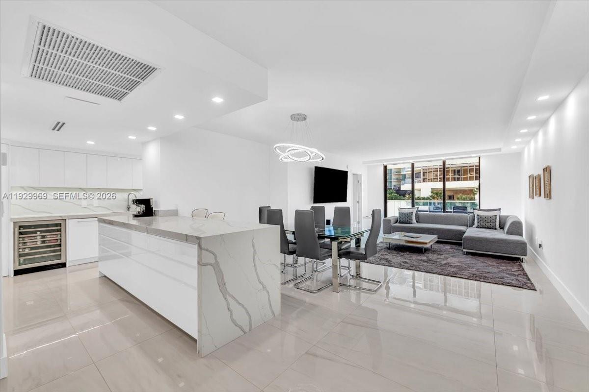 Totally renovated and sophisticated 3-bedroom, 2.5-bath residence on the desirable South Side, filled with natural light throughout. This modern, open floor plan features a stunning chef’s kitchen with a spacious island, equipped with an Electrolux cooktop and double oven, wine cellar, Frigidaire double-door refrigerator and freezer, and a Miele dishwasher. The home also includes a washer & dryer and custom high-end built-ins throughout. A newly installed glass balcony enclosure enhances the expansive views, creating a true “home-like” feel while maximizing light and livability. Conveniently located on the 5th floor, the residence offers beautiful ocean views and an ideal balance of comfort and accessibility. The Balmoral is renowned for its impeccable 5 star services such as beach & pool service and attendants, Valet parking, bellman, newly restored fitness center, 24hr security, brand new tennis courts The Balmoral is an exquisite address located directly across the Bal Harbour Shops, walking distance to the buzzing Harding District of Surfside with a variety of great restaurants and shopping, the fabulous new Bal Harbour waterfront park and new Bal Harbour Village recreation center, and walking distance to houses of worship. Discover the ultimate luxury lifestyle in Bal Harbour, perfectly blending sophisticated city living with effortless beachside elegance.