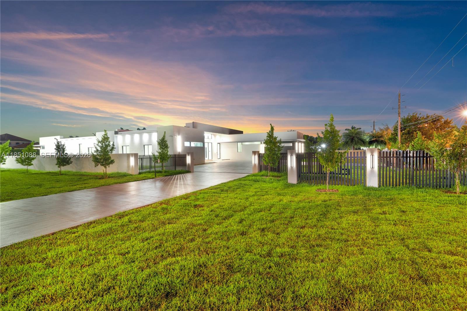 Immerse yourself in this 2025 architectural masterpiece, offering over 6,000 sq ft of pure elegance. This exclusive estate features 5 bedrooms, 6.5 meticulously designed bathrooms, and a executive office.  Every inch of this home exudes sophistication, from the soaring ceilings to the expansive floor-to-ceiling glass that floods the interiors with natural light and showcases the home’s impeccable design and seamless indoor-outdoor flow. A grand 20-foot foyer introduces an open-concept layout adorned with custom finishes, state-of-the-art smart home technology, and a surveillance system for total peace of mind. The backyard is a private sanctuary, with an oversized pool, spa, and a custom outdoor kitchen perfect for entertaining. Ideally located near Miami Airport and top-rated schools.