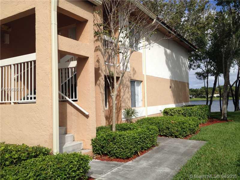 Upscale condo with lovely lakefront view.  Renovated kitchen with granite counters, glass-front cabinets.  Neutral stone tile in living areas.  Both bathrooms have been tastefully updated.  Full size washer/dryer in unit.  Big screened patio overlooks tranquil lake.  Quiet, well maintained central Plantation community with pool, hot tub, tennis, exercise room.  Wonderful location across from Central Park and just minutes away from great shopping and dining