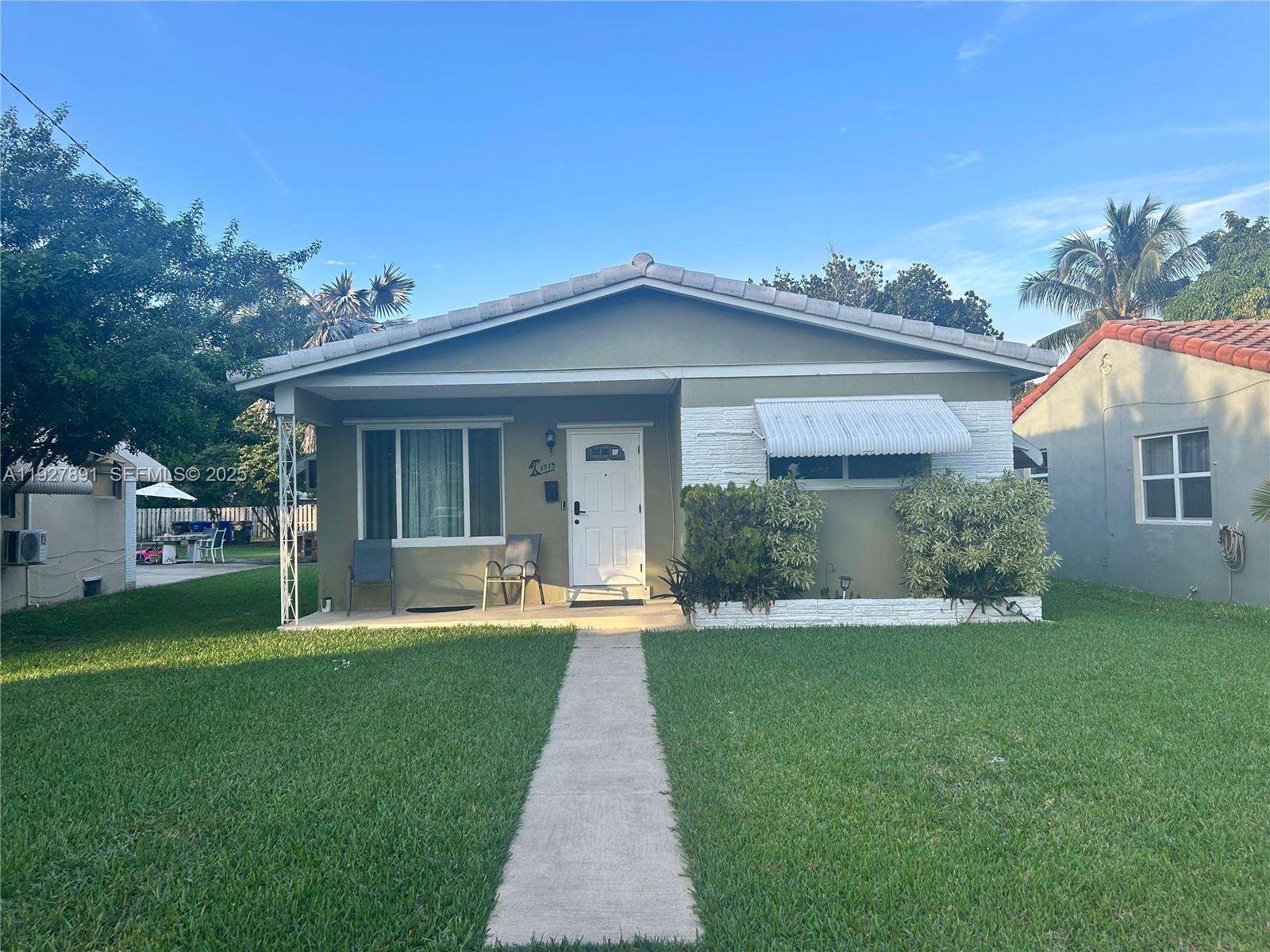 SECURE THIS HOME'S $400K +/- ASSUMABLE FHA MORTGAGE AT 4.75%, AND SAVE THOUSANDS ANNUALLY. SECURE A FASTER CLOSE WHEN YOU WORK WITH ROAM. INQUIRE WITH LISTING AGENT FOR DETAILS. Charming and beautifully updated home. Current set up is a 2BR/1BA (897 SF) with 0/1 studio (325 SF) with separate entrance, in the highly desirable neighborhood of East Hollywood. This turnkey residence features impact windows, upgraded kitchen with stainless steel appliances, renovated baths, mini split A/C system, and tankless water heater. Enjoy an open-concept layout with immaculate terrazzo floors and abundant natural light. Property offers a deep driveway and a fenced yard with outdoor entertaining space, and a storage shed. Tile roof in great condition. Prime location just minutes to Downtown Hollywood, Young Circle, beaches, shops, and dining. Move-in ready or ideal as an investment property. Decor and furniture included. Don't miss out.