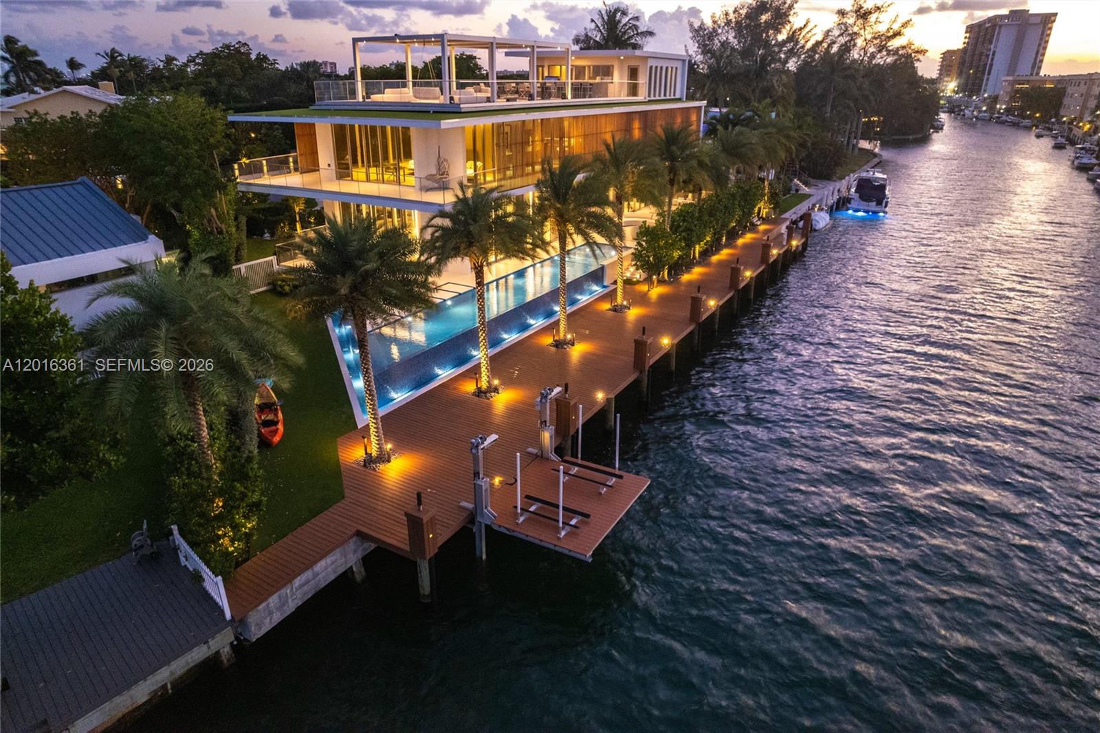 The last private estate before open Biscayne Bay.
163 feet of private waterfront frontage. No fixed bridges. Direct ocean access. A 2,000 SF dock with 6.5 feet of depth accommodates vessels up to approximately 90 feet.
This is not simply a waterfront home. It is a turnkey boating estate.
Delivered fully furnished with a $350,000 Artefacto collection, the 2023 residence offers approximately 8,200 SF across three levels, six bedrooms, nine and a half baths, a custom Mia Cucina kitchen, smart-home technology, generator, jet ski lift, nine parking spaces, and city permit approved for fence construction.
The rooftop is the showpiece. An outdoor kitchen, motorized pergola, integrated 8-speaker AV system, and panoramic views stretching from Bal Harbour to Sunny Isles and Downtown Miami create one of the most compelling entertaining spaces in the Miami waterfront market.
Private cul-de-sac. Keystone Point. $15,490,000 furnished.