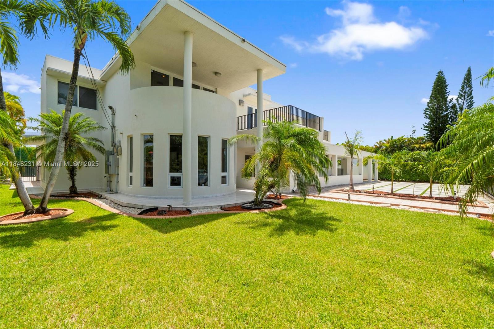 Modern pool home with hurricane protection custom build with concrete and steel roof, impact windows and doors open layout 22 foot ceiling in the living room with half bathroom, large family room, formal dining office, playroom laundry room, modern Italian kitchen with quartz countertop and high end appliances one guest bedroom and fall bath on the first floor upstairs 4 bedroom three full bath plus loft, spacious master suite with sitting area, gym and large bathroom, porcelain tile throughout. shower and bathroom in the pool area.